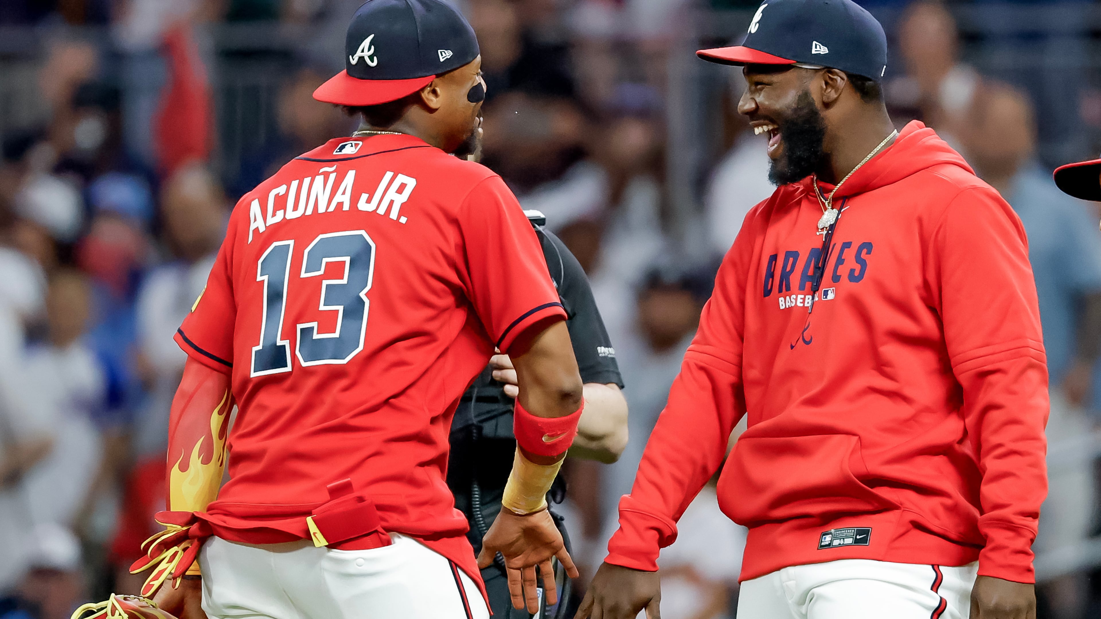 Atlanta Braves' Ronald Acuna Jr. (13) and Michael Harris II, right, celebrate after their team defeated the Philadelphia Phillies in a baseball game, Friday, April 24, 2026, in Atlanta. (AP Photo/Erik S. Lesser)