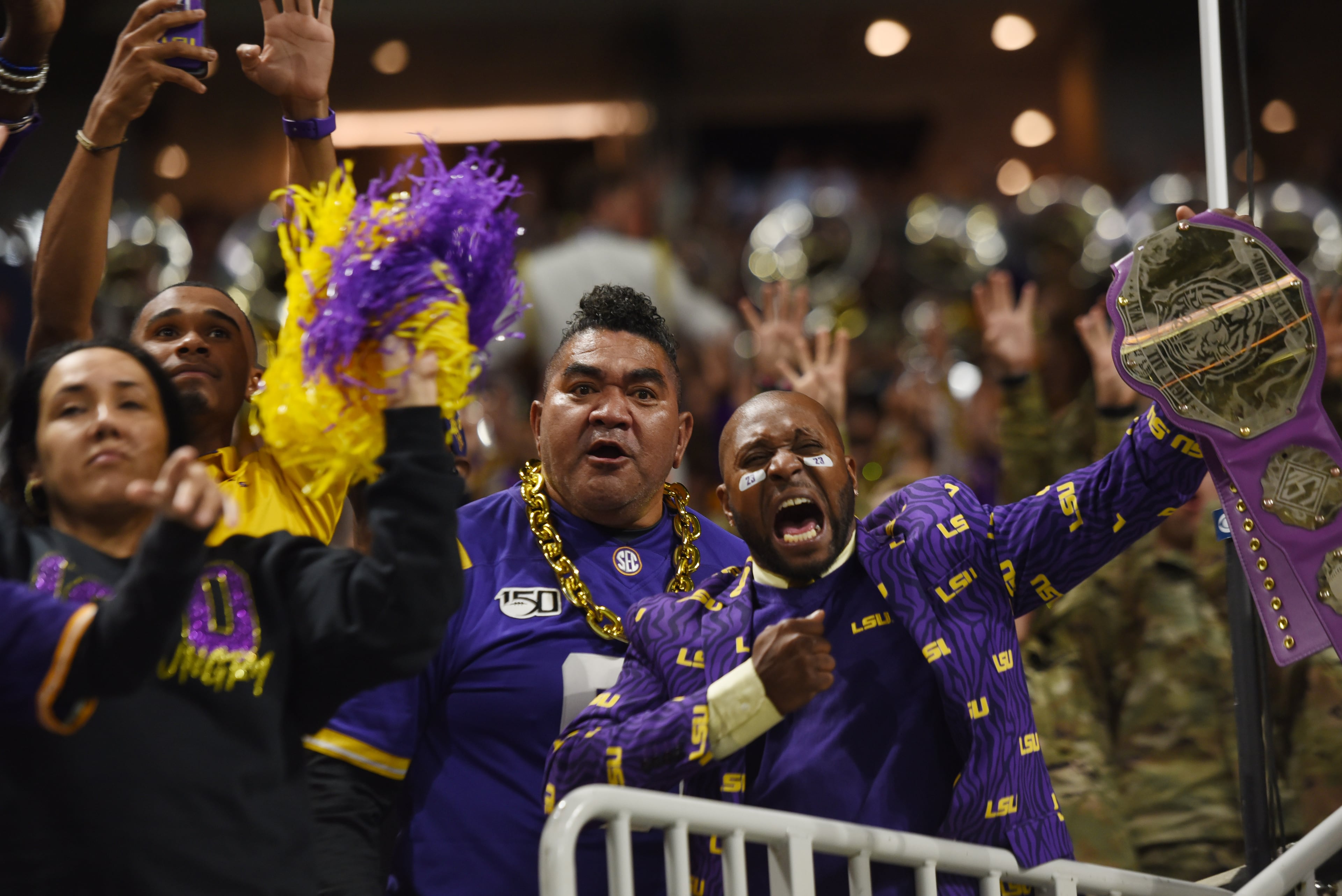 LSU Tigers fans celebrate during the second half of the Georgia vs. LSU SEC Football Championship game at Mercedes-Benz Stadium in Atlanta. Ryon Horne / ryon.horne@ajc.com