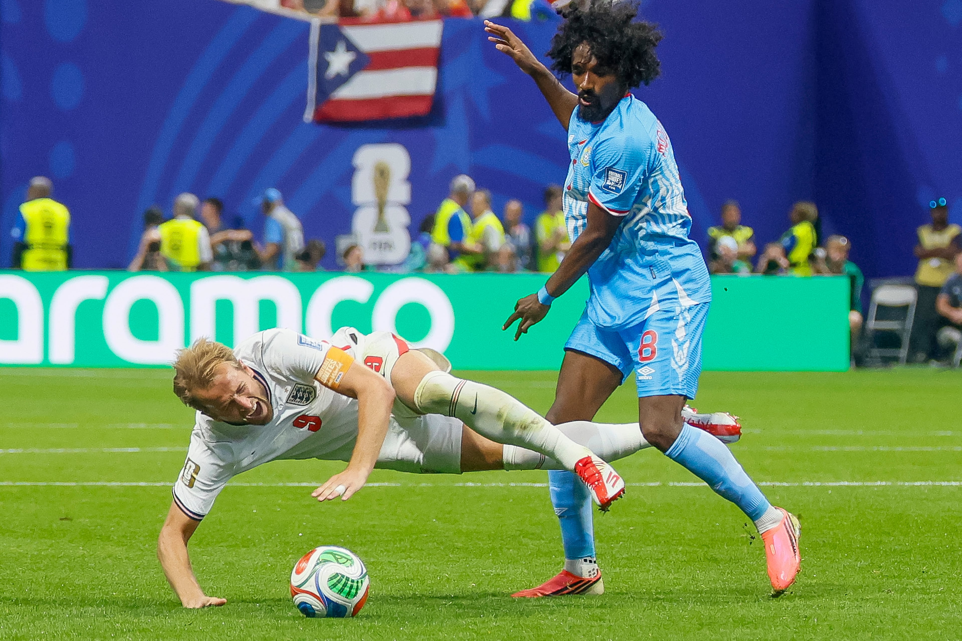 England forward Harry Kane (left) reacts after a foul by Congo midfielder Samuel Moutoussamy (right) during the second half of a FIFA World Cup round of 32 match at Atlanta Stadium (Mercedes-Benz Stadium) on Wednesday, July 1, 2026, in Atlanta. (Miguel Martinez/AJC)