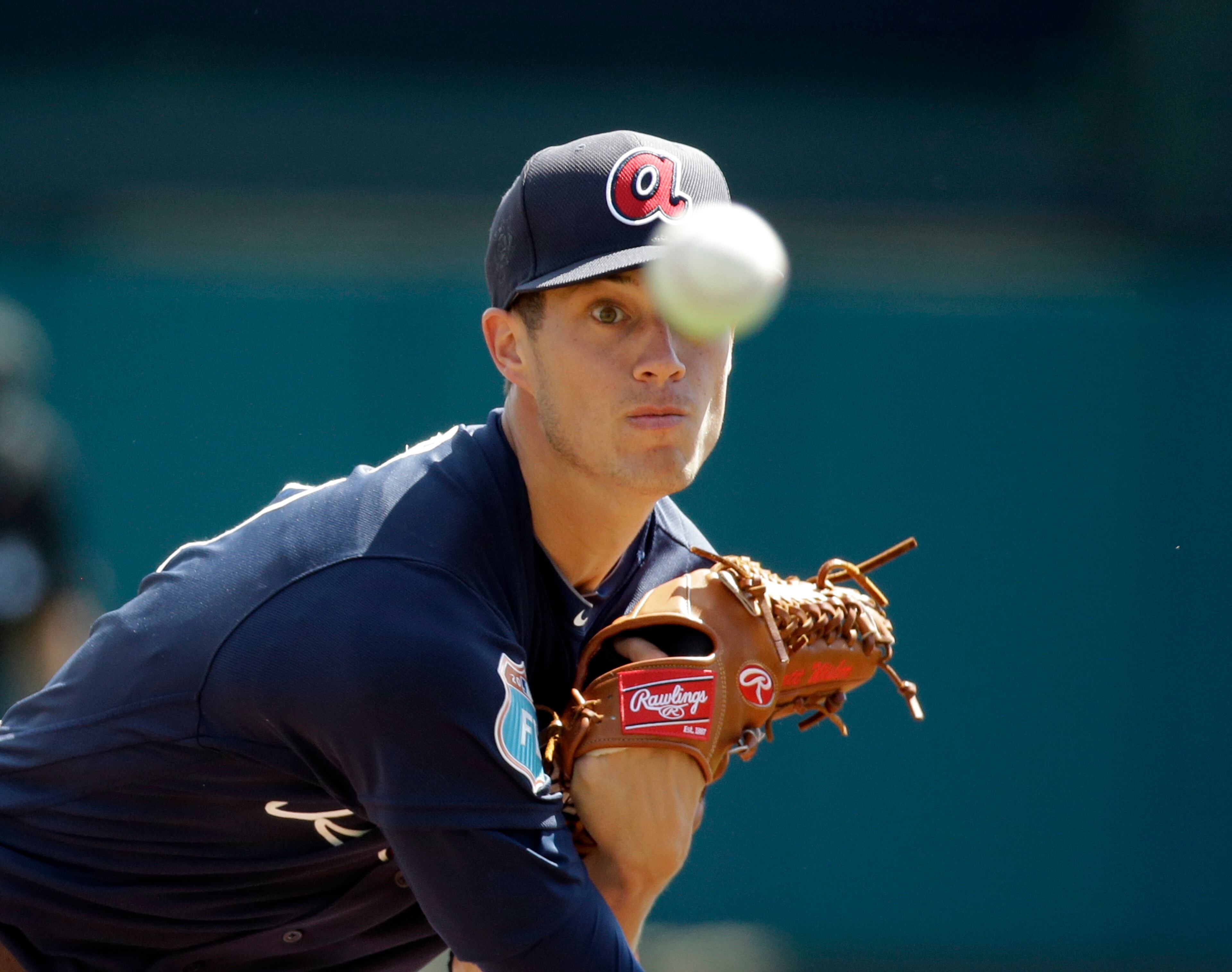 Keep your eye on the ball: The Braves' Matt Wisler pitches against the New York Mets on Tuesday, March 8 in Kissimmee, Fla. (AP Photo/John Raoux)