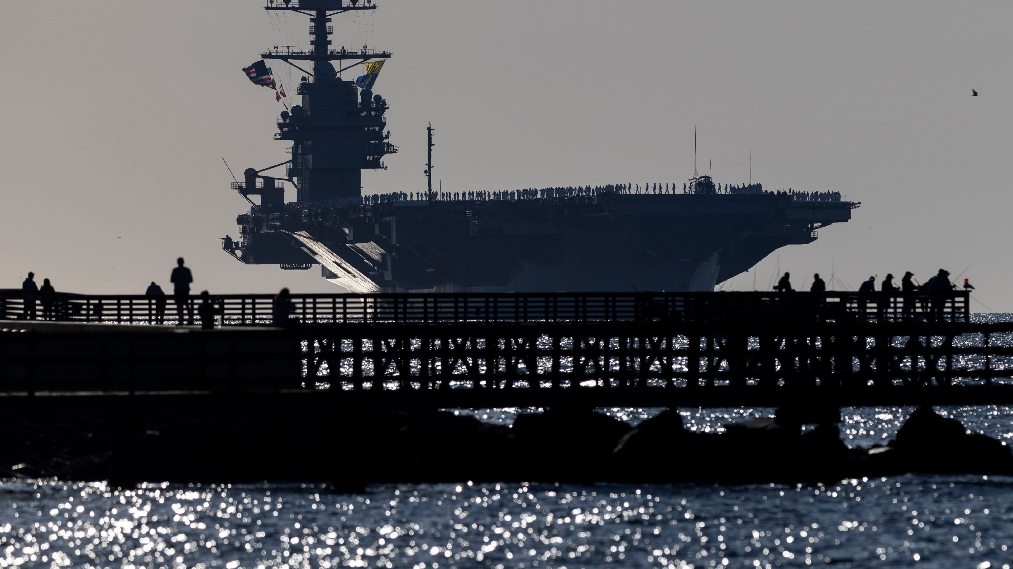 The USS Gerald R. Ford heads toward port at Naval Station Norfolk, as seen from Fort Monroe, Va., on May 16, 2026. (Peter Casey/The Virginian-Pilot via AP)