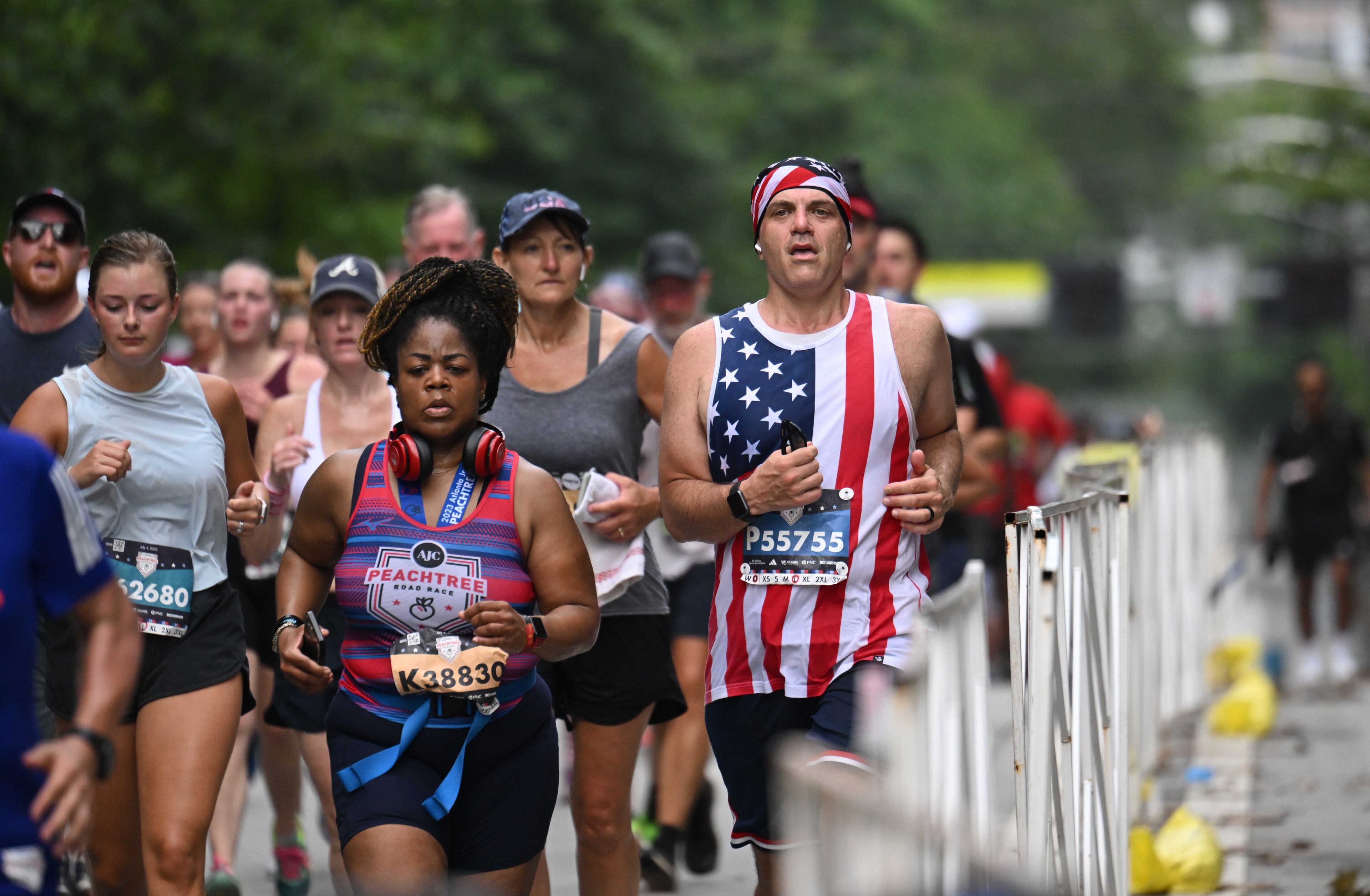 Runners run toward the finish line during the 54th running of the Atlanta Journal-Constitution Peachtree Road Race during the 2023 Atlanta Journal-Constitution Peachtree Road Race, Tuesday, July 4, 2023, in Atlanta. (Hyosub Shin / Hyosub.Shin@ajc.com)