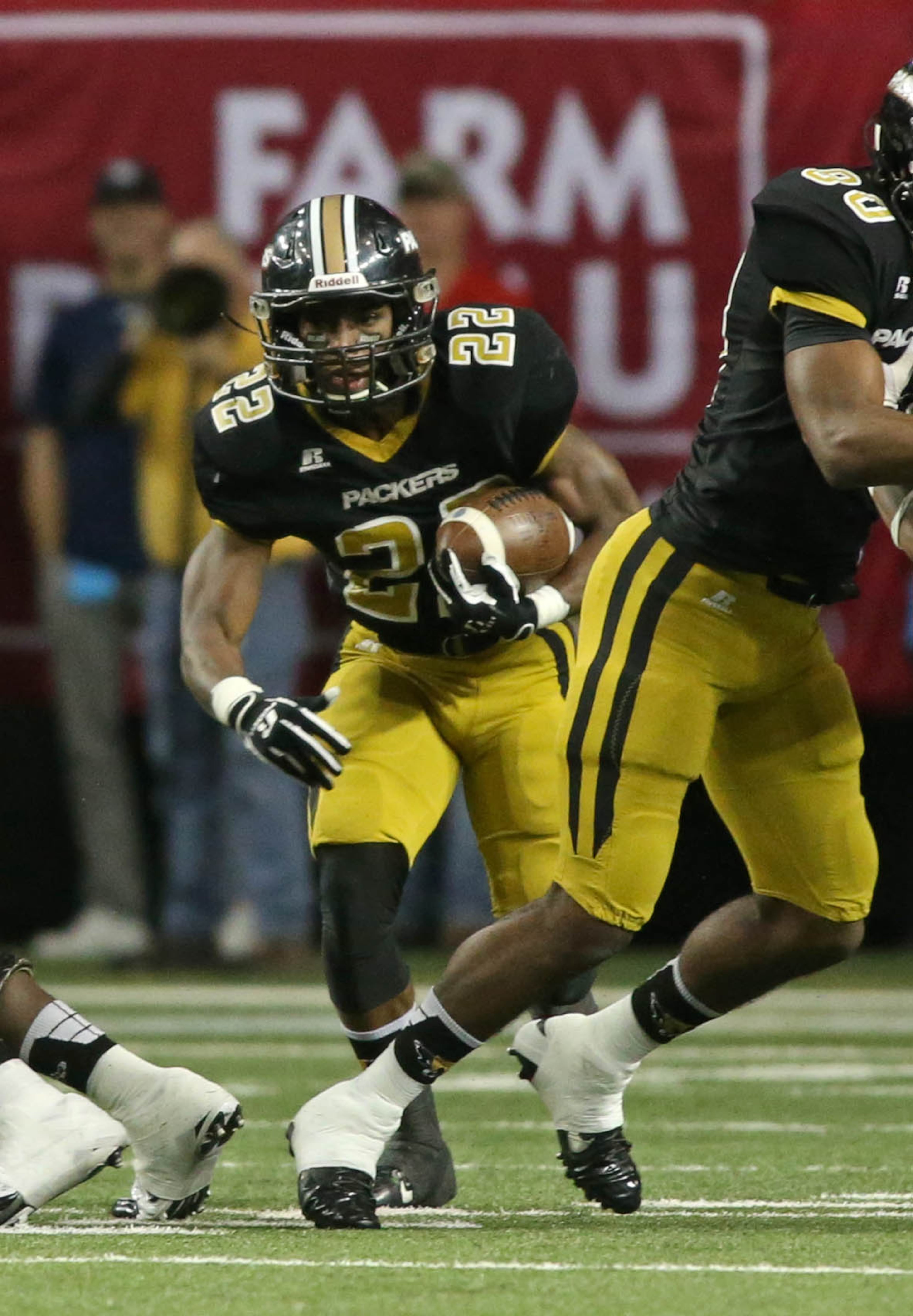 Colquitt County running back Sihiem King (22) runs for a short gain in the first half of their game against Archer in the Class AAAAAA state high school football championship at the Georgia Dome Saturday in Atlanta, Ga., December 13, 2014.