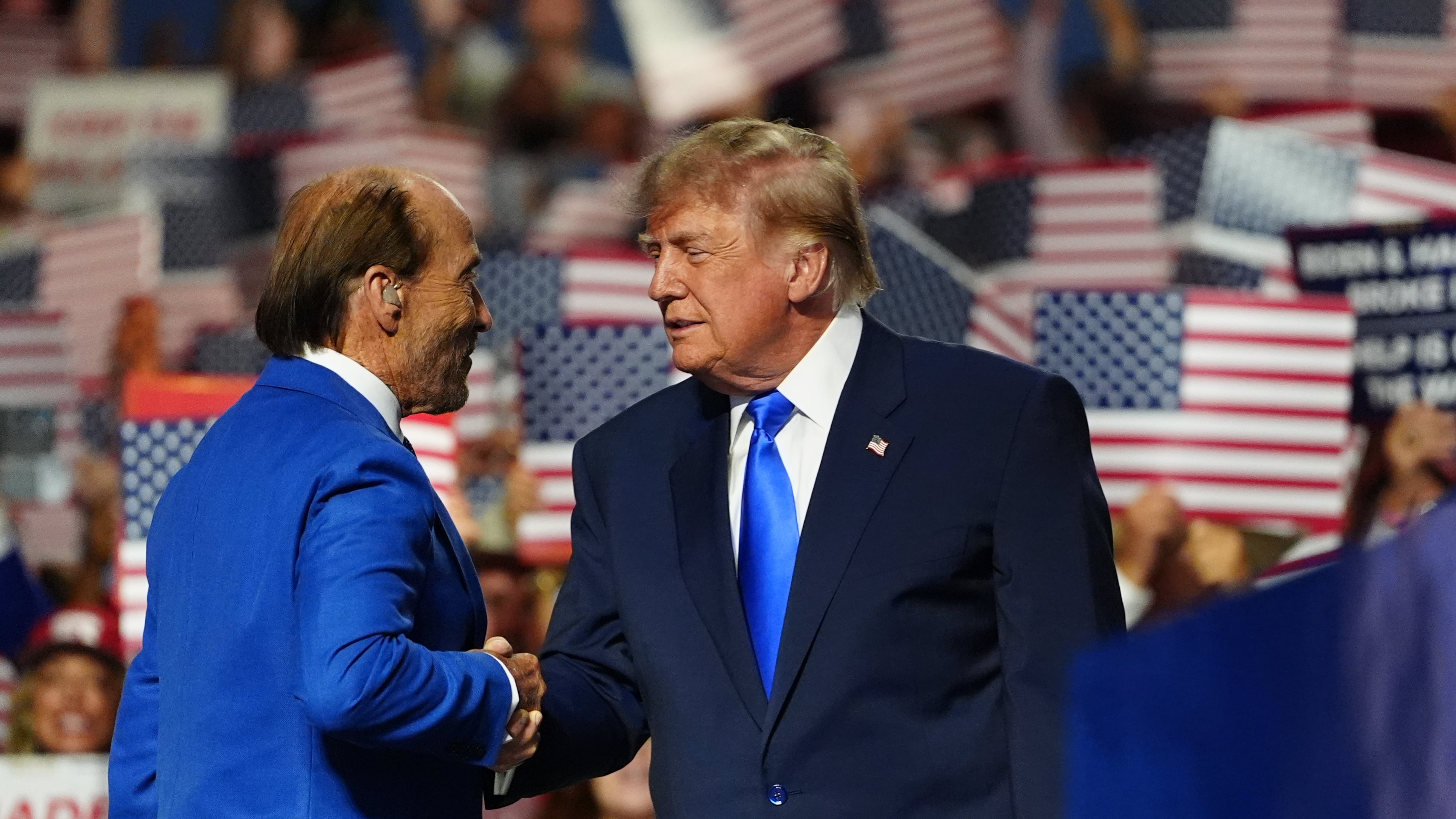 President Donald Trump greets Lee Greenwood at the Republican convention, Wednesday, Sept. 9, 2026, in Dallas. (AP Photo/Julia Demaree Nikhinson)