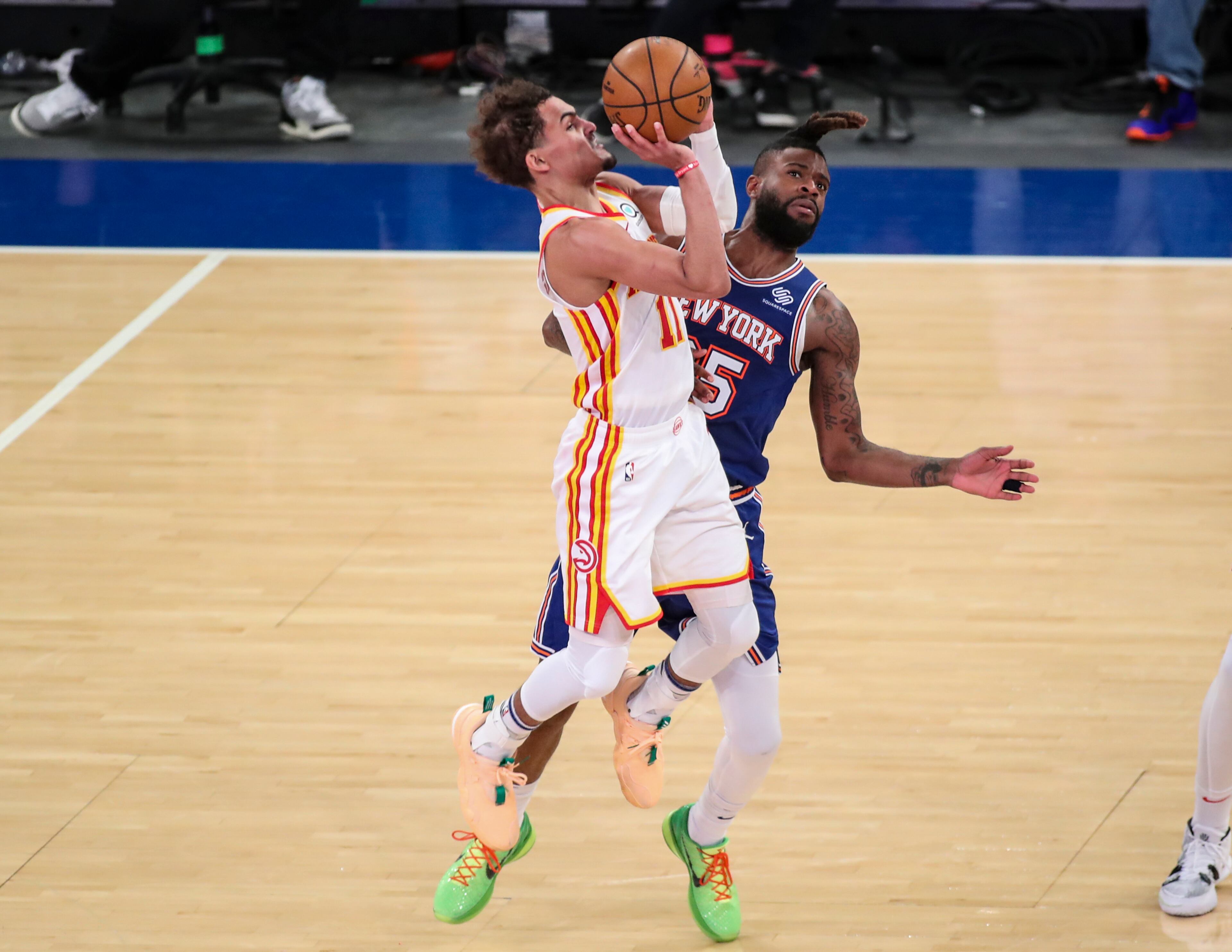 Atlanta Hawks guard Trae Young (11) shoots a 3-pointer as New York Knicks forward Reggie Bullock (25) defends during the fourth quarter of Game 5 of an NBA basketball first-round playoff series Wednesday, June 2, 2021, in New York. (Wendell Cruz/Pool Photo via AP)