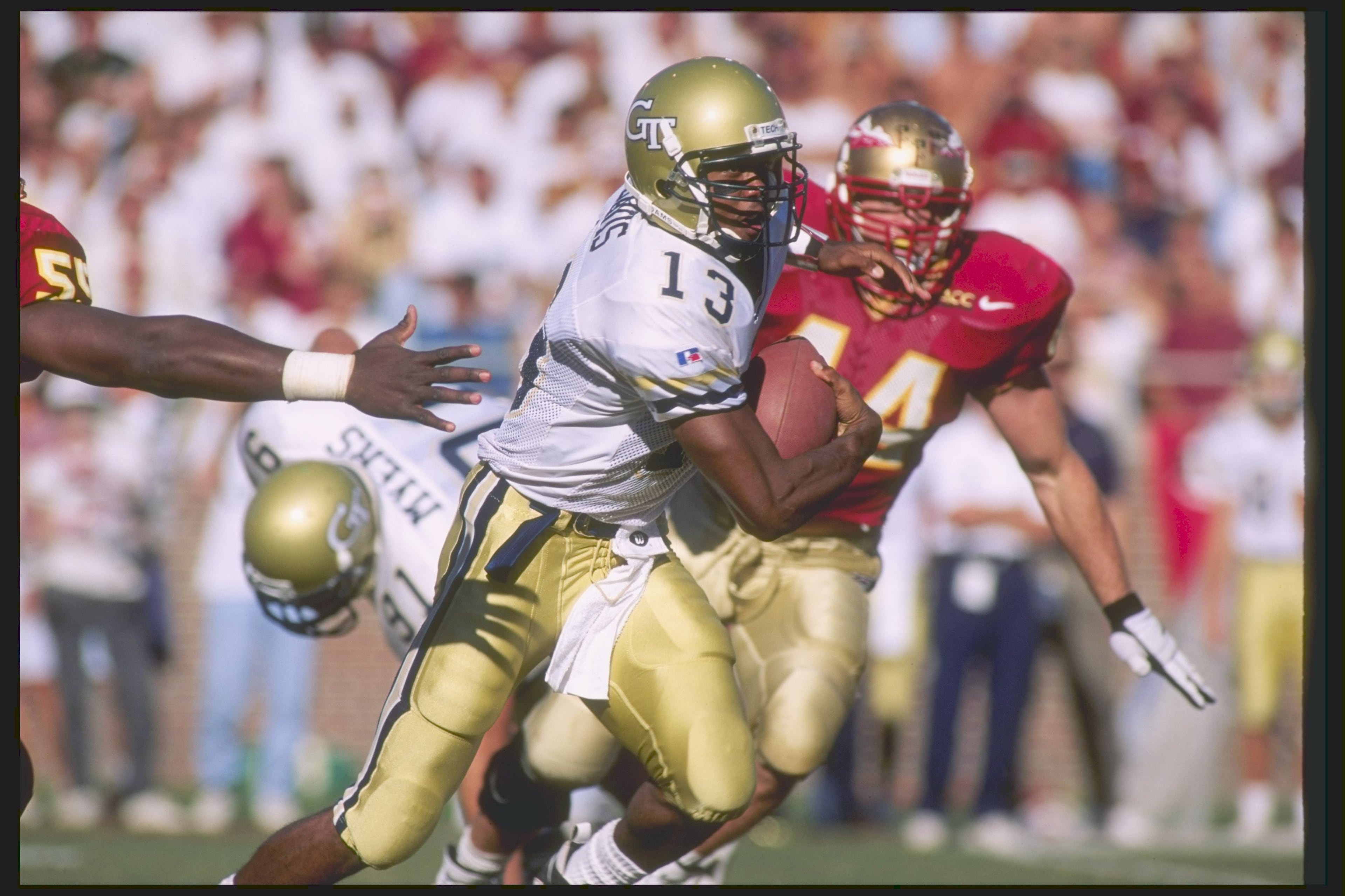 Georgia Tech quarterback Donnie Davis runs down the field during a game at Florida State in 1995. Andy Lyons / Allsport USA