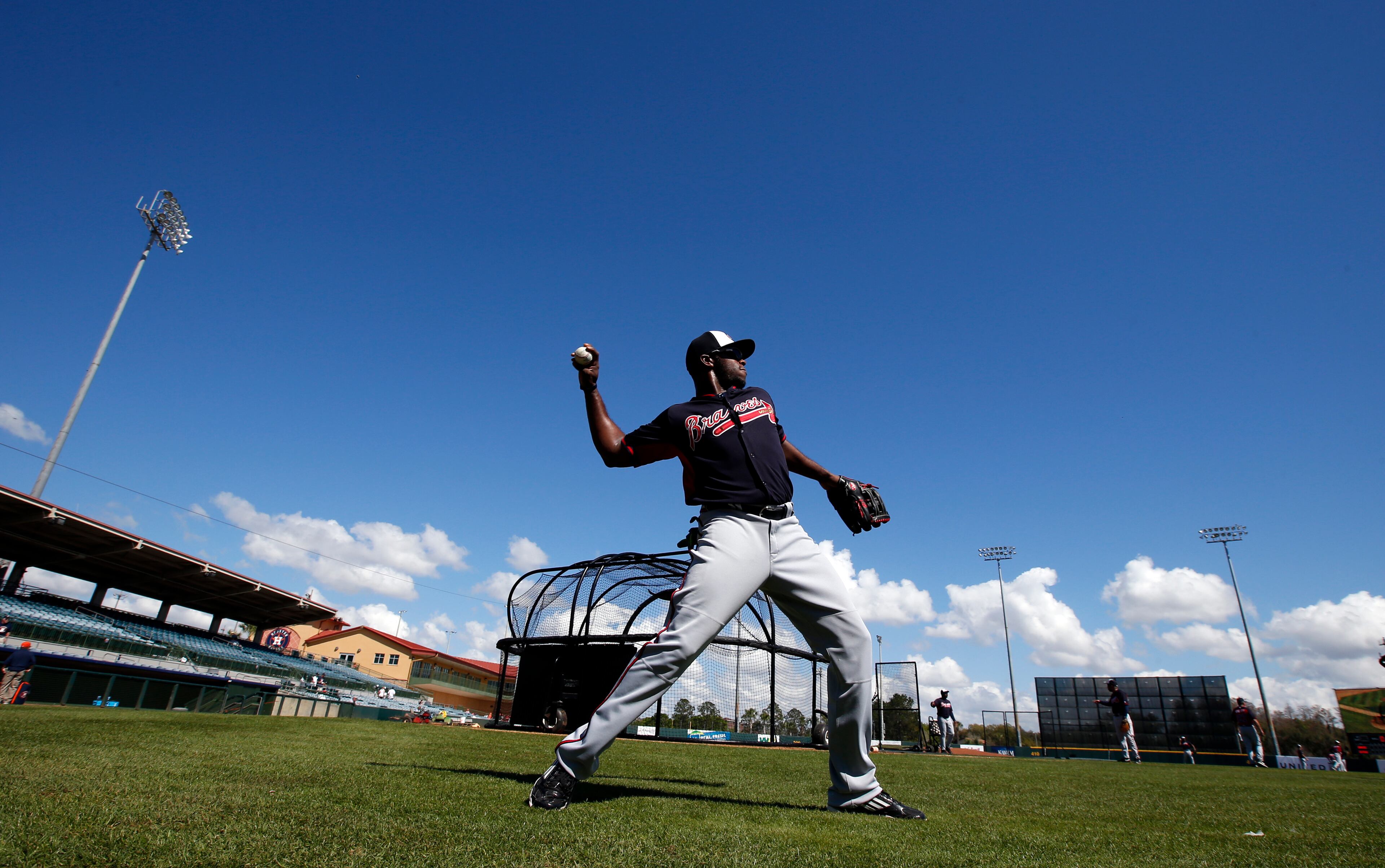 Atlanta Braves left fielder Justin Upton (8) warms up before a spring exhibition baseball game against the Houston Astros, Sunday, March 2, 2014, in Kissimmee, Fla. (AP Photo/Alex Brandon)