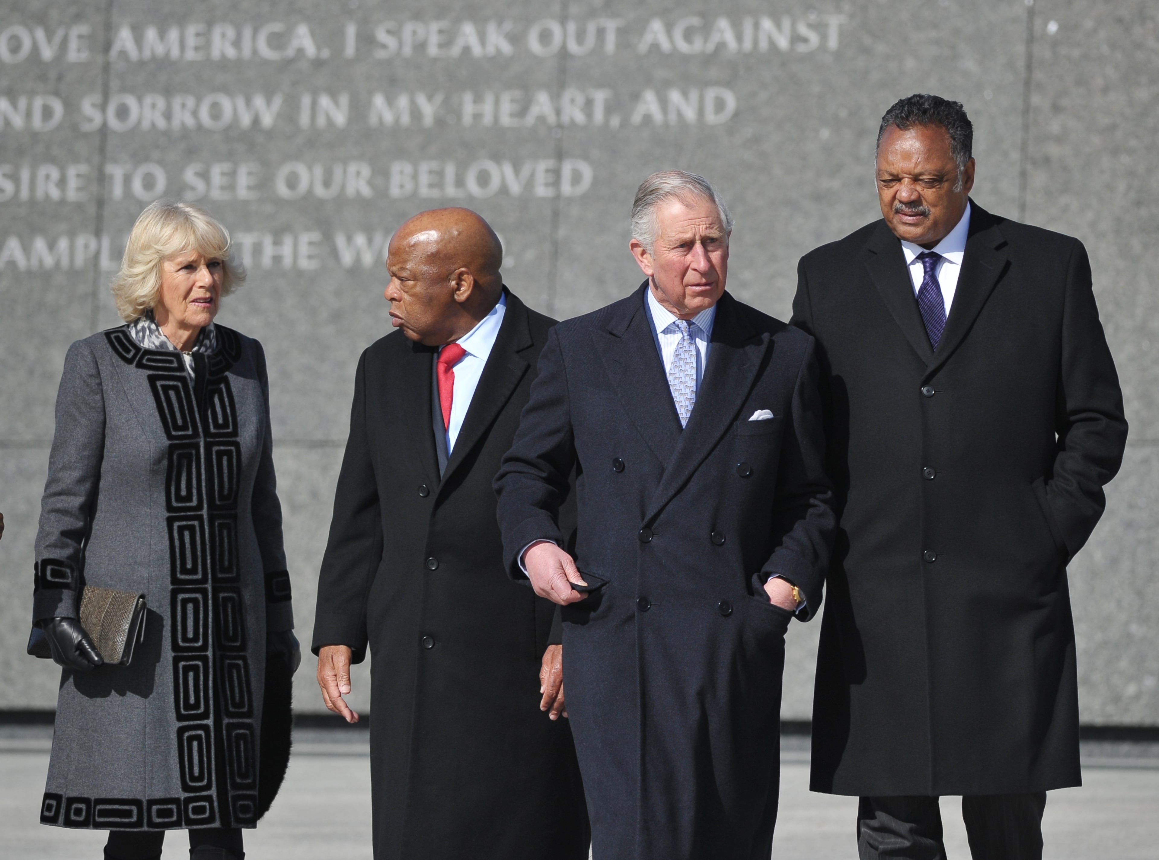 Britain's Prince Charles chats with Rev.Jesse Jackson while his wife Camilla, the Duchess of Cornwall chats with Rep John Lewis, D-Ga., during a visit to the Martin Luther King Jr. Memorial in Washington, March 18, 2015. (AP Photo/Mandel Ngan, Pool)