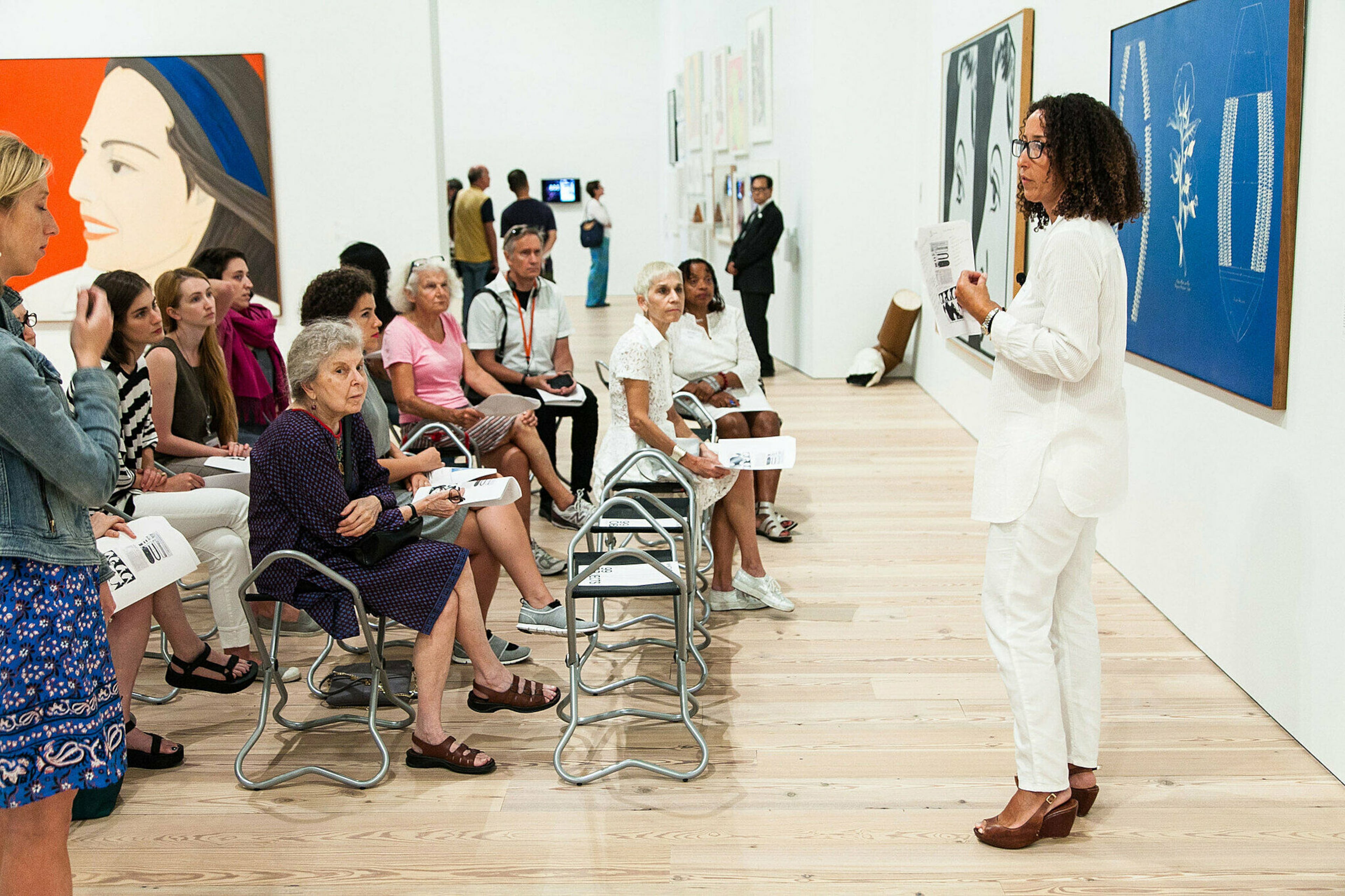Art scholar Cheryl Finley (in white, far right) speaks at the Whitney Museum of Art in 2015 for the reopening in downtown New York of the show "99 Objects." (Courtesy of Cheryl Finley)