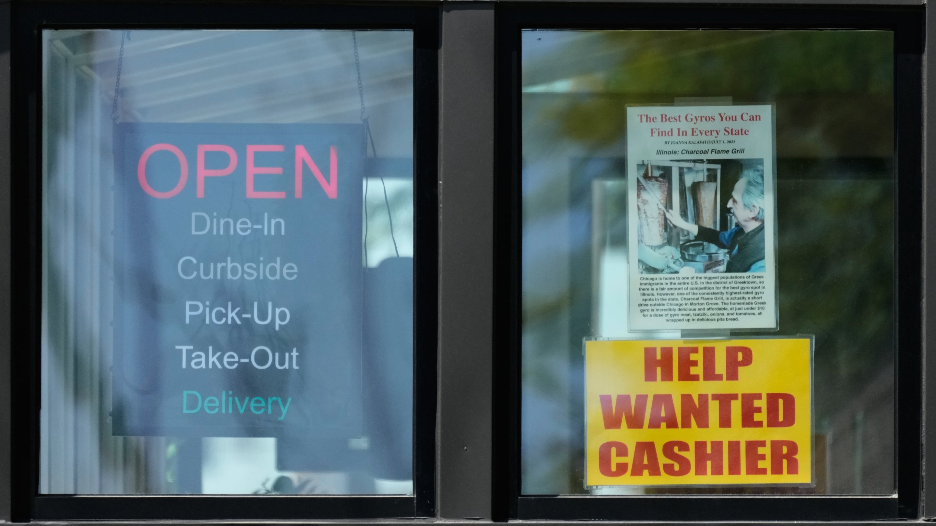A hiring sign is displayed at a restaurant in Morton Grove, Ill., Thursday, May 14, 2026. (AP Photo/Nam Y. Huh)