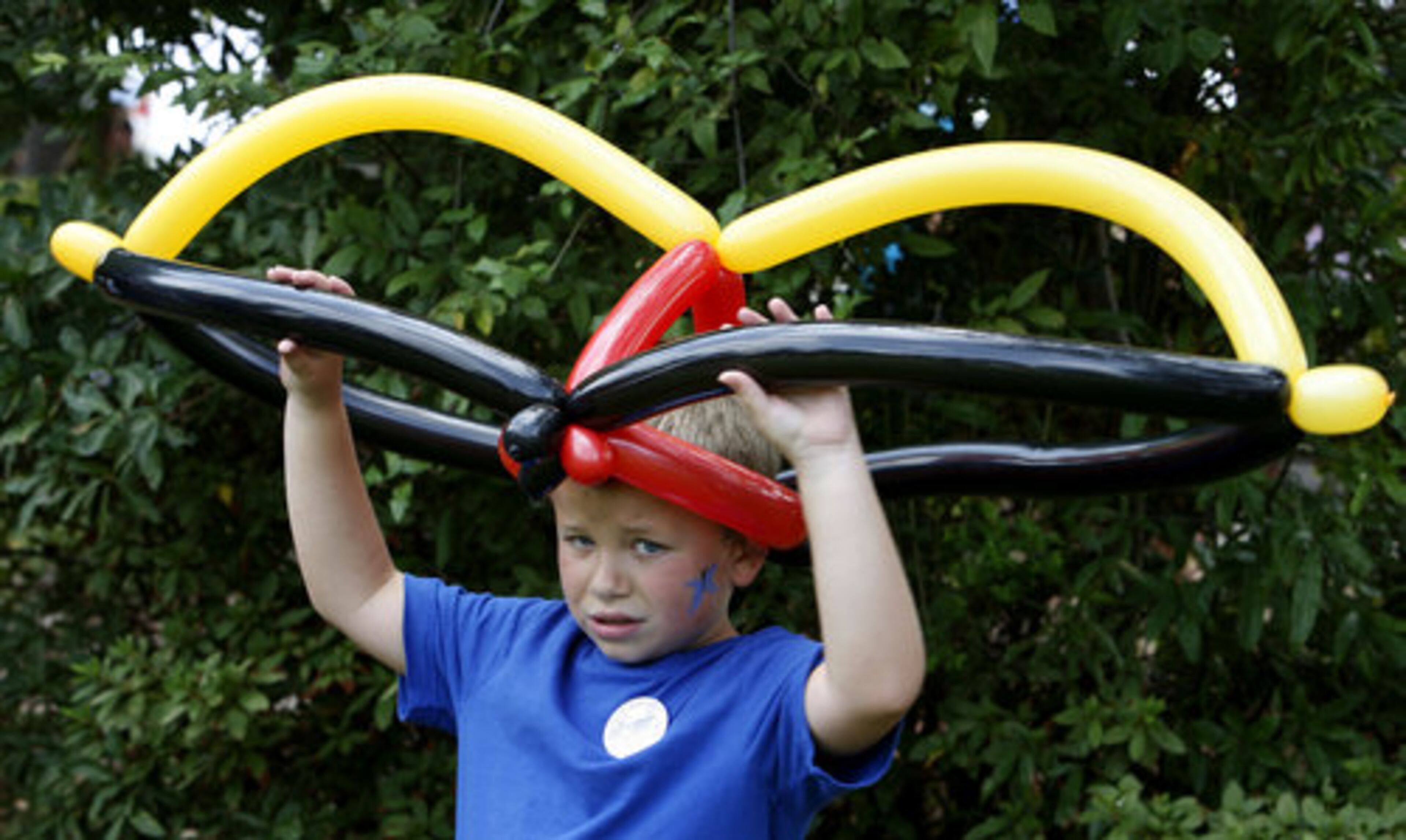 Seems like 7-year-old Collin Butch doesn't seem to know what to do with his crazy balloon hat!