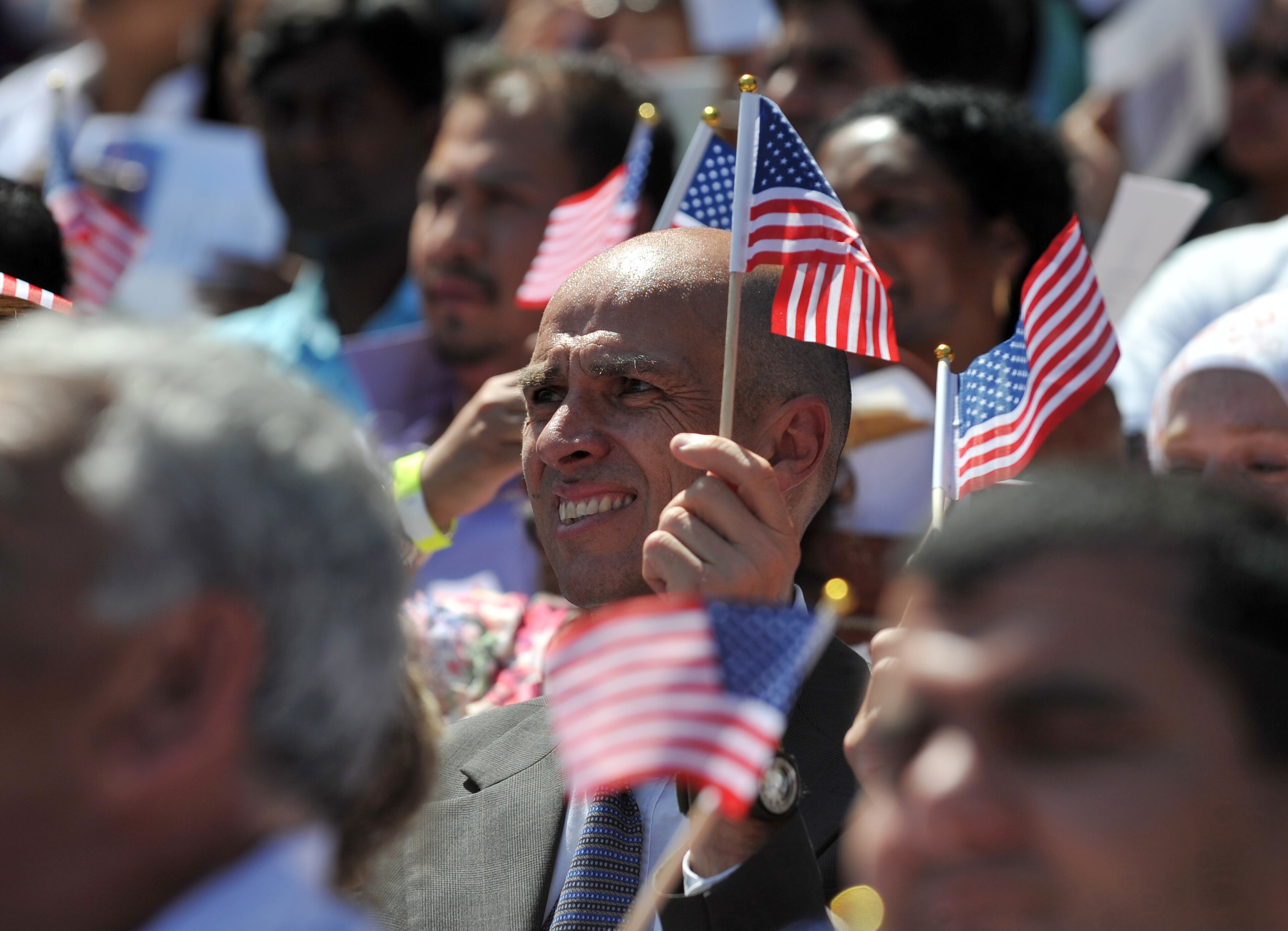 Around 1,000 immigrants officially became citizens of the United States during a naturalization ceremony at Turner Field Wednesday July 2, 2014. BRANT SANDERLIN /BSANDERLIN@AJC.COM.