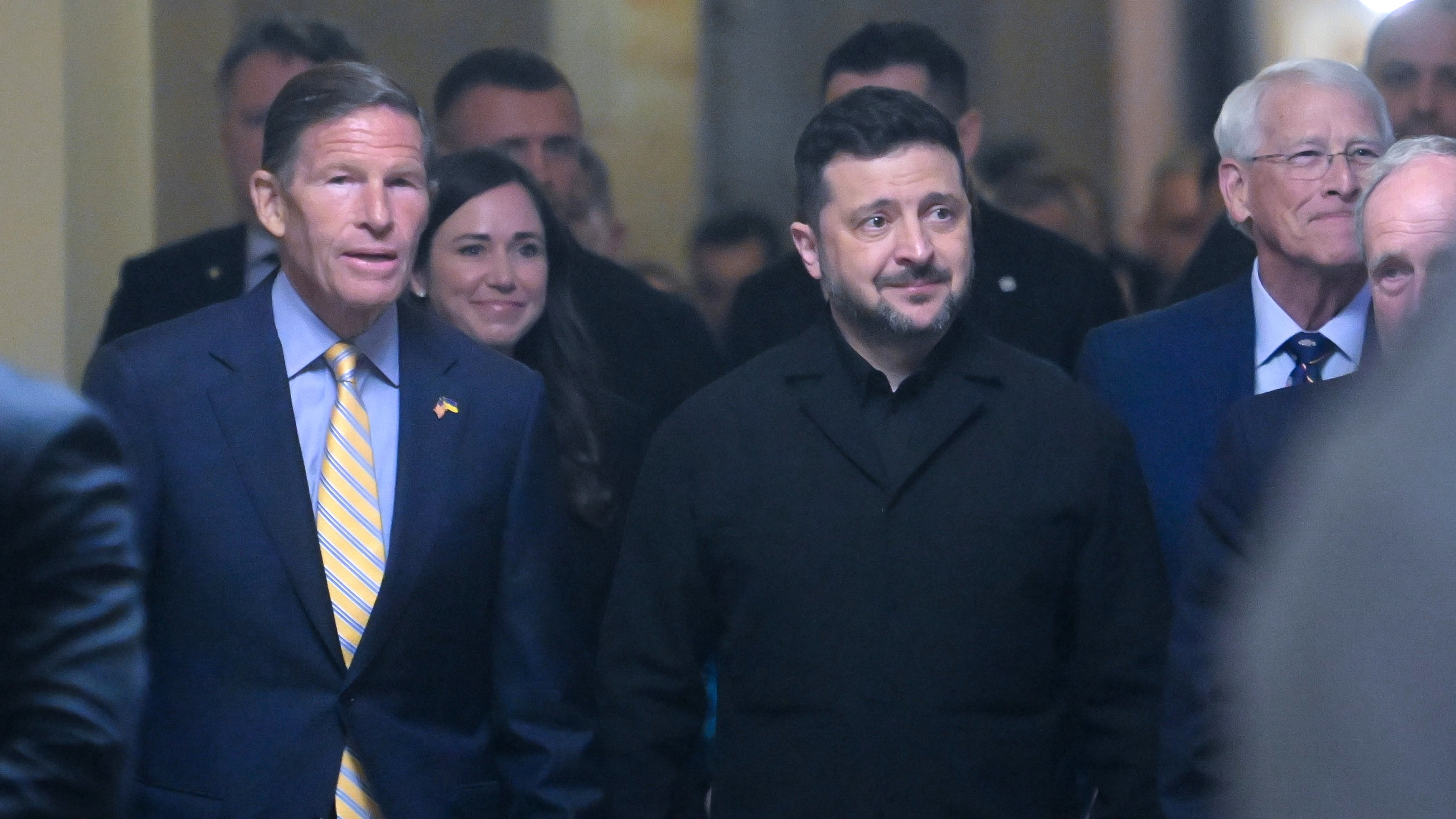 Ukraine President Volodymyr Zelenskyy, is joined by from left: Sen. Richard Blumenthal, D-Conn., Sen. Katie Boyd Britt, R-Ala., Sen. Roger Wicker, R-Miss., and Sen. James Risch, R-Idaho, as he arrives at the U.S. Capitol for a meeting of bipartisan leaders of the Lindsey O. Graham Sanctioning Russia and Iran Act of 2026, Tuesday, July 28, 2026, in Washington. (AP Photo/Rod Lamkey, Jr.)