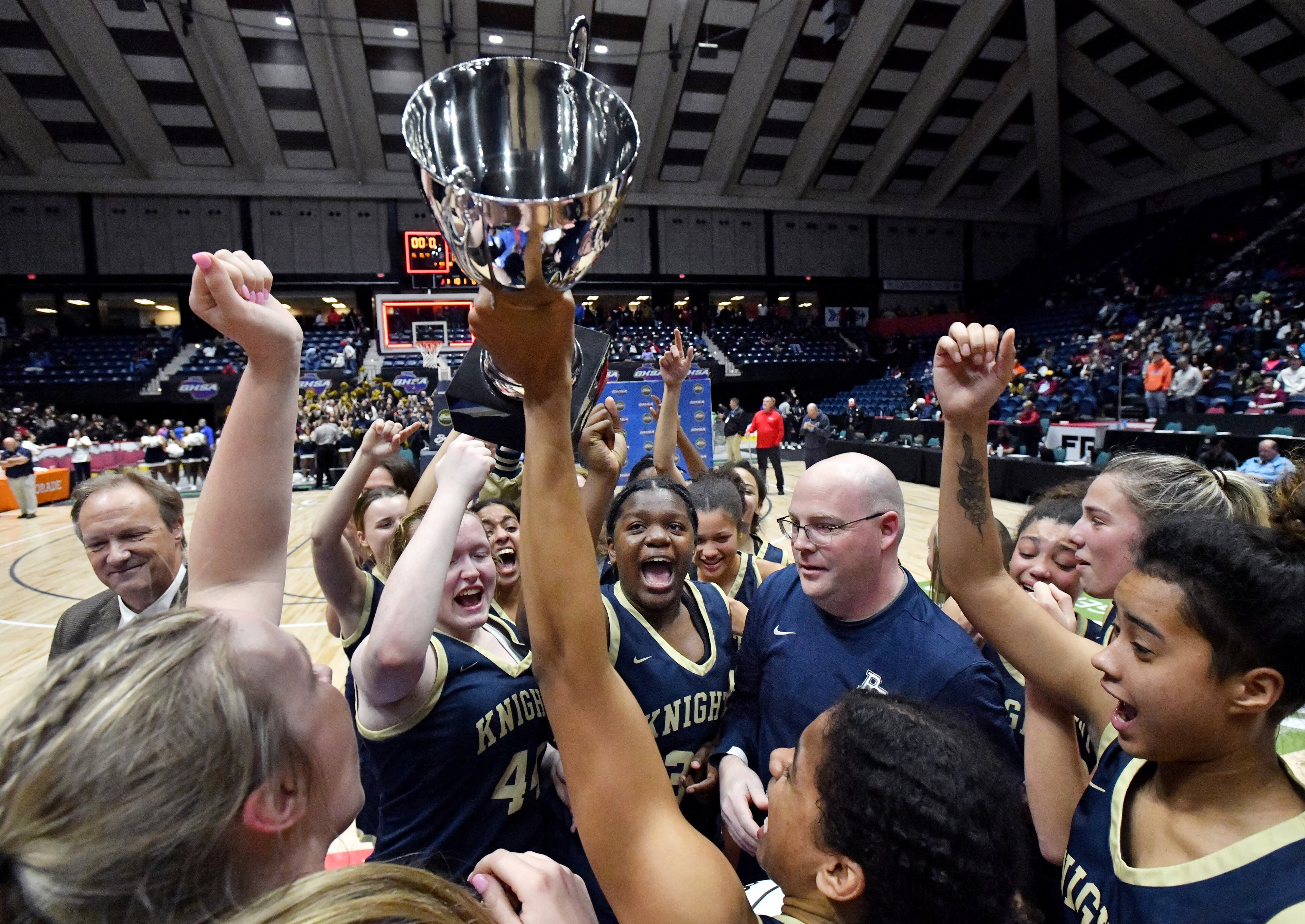 River Ridge players celebrate their win over Lovejoy Friday in the Class 6A girls state championship game in Macon.