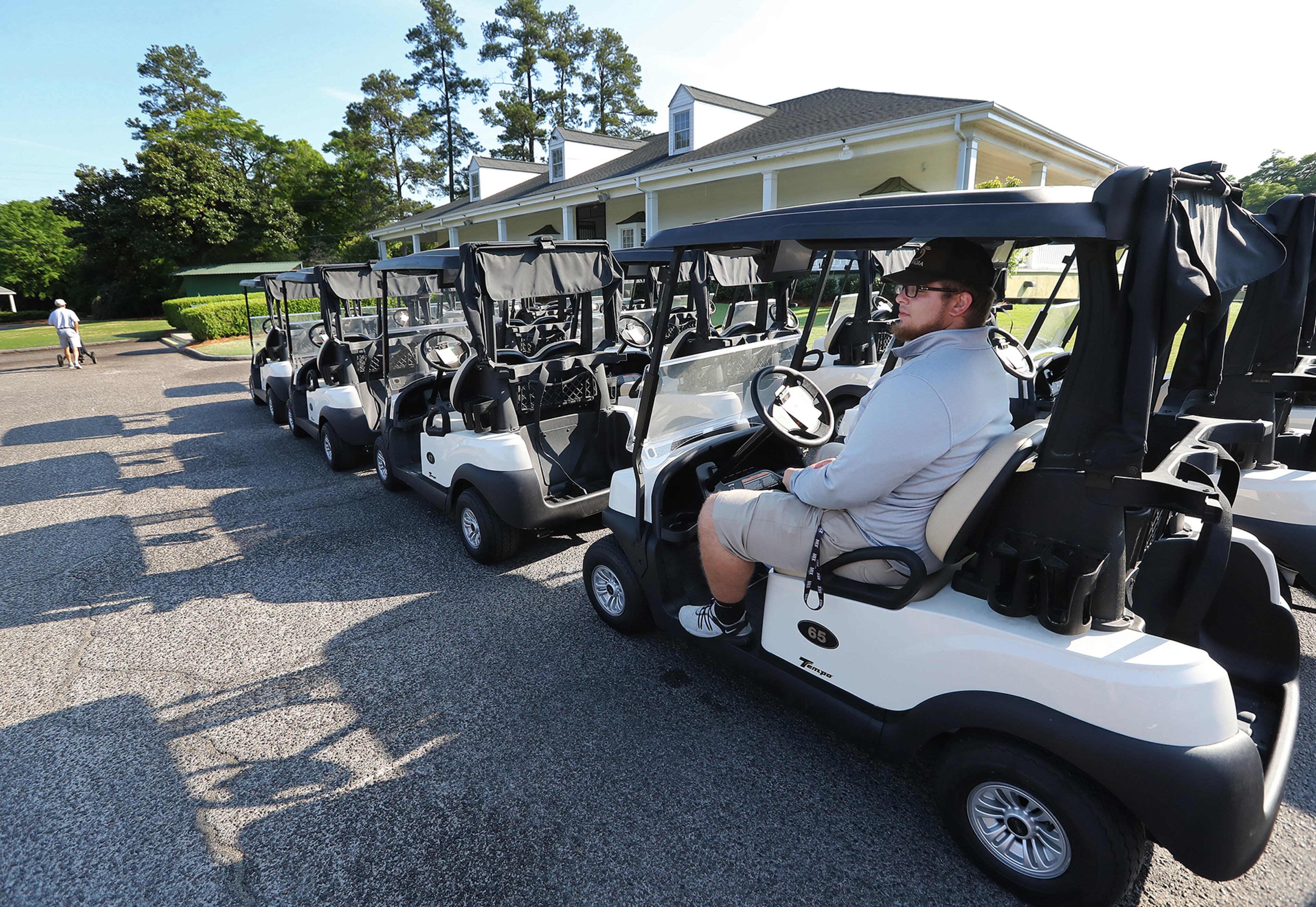 April 6, 2020 Augusta: Plenty of carts are avialable as cart attendant Jacob Pederson waits for golfers at Forest Hills Golf Club with things quiter and cheaper on what would have been the first practice round for the Masters bringing in large crowds on Monday, April 6, 2020, in Augusta. In collaboration with the leading organizations in golf, Augusta National Golf Club has identified November 9-15 as the intended dates to host the 2020 Masters. Curtis Compton ccompton@ajc.com