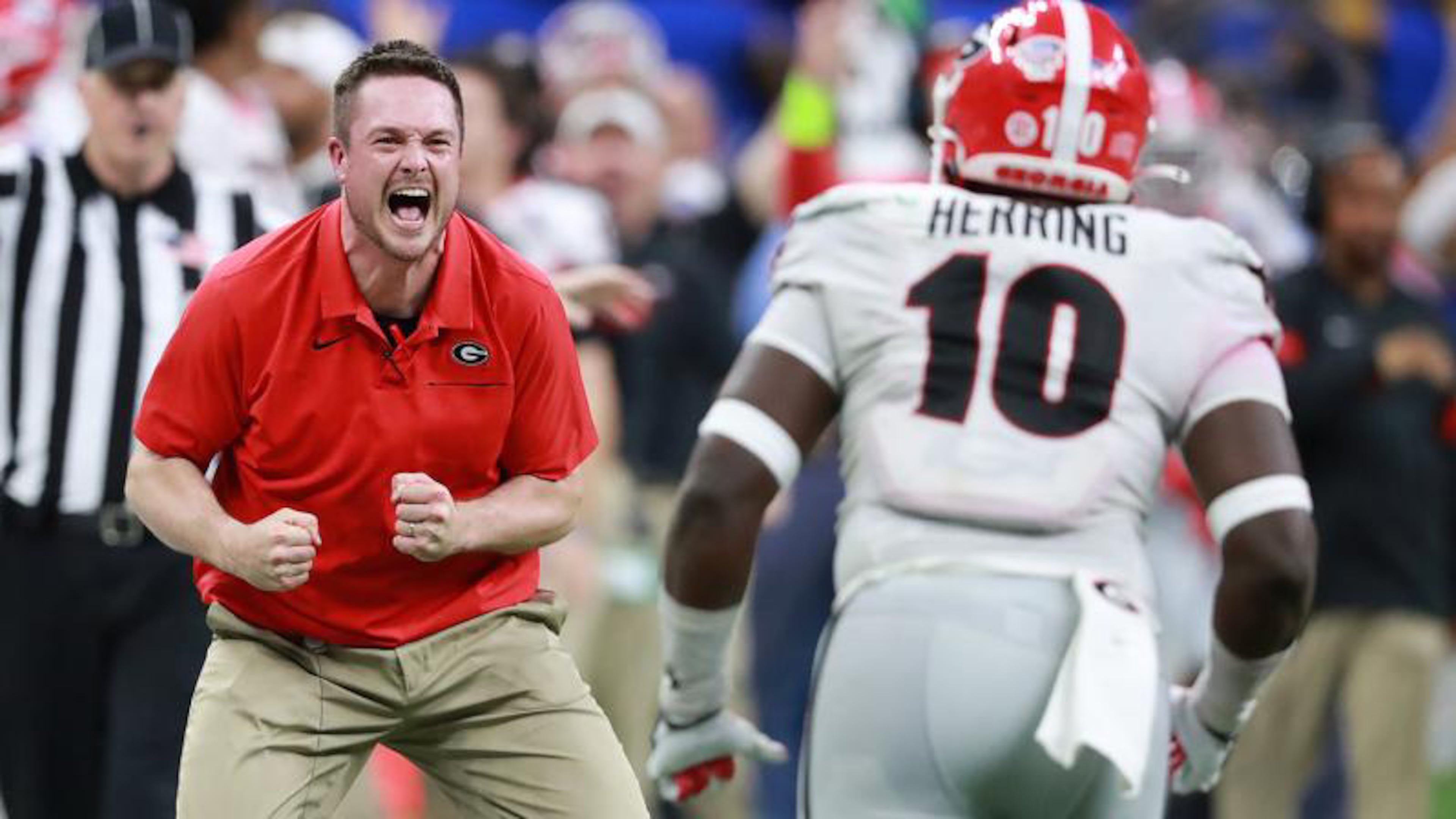 Georgia defensive coordinatory Dan Lanning and defensive lineman Malik Herring begin to celebrate after Richard LeCounte intercepted a Baylor pass in the final minutes to seal a 26-14 victory in the Sugar Bowl at the Superdome on Wednesday, January 1, 2020, in New Orleans. Curtis Compton ccompton@ajc.com