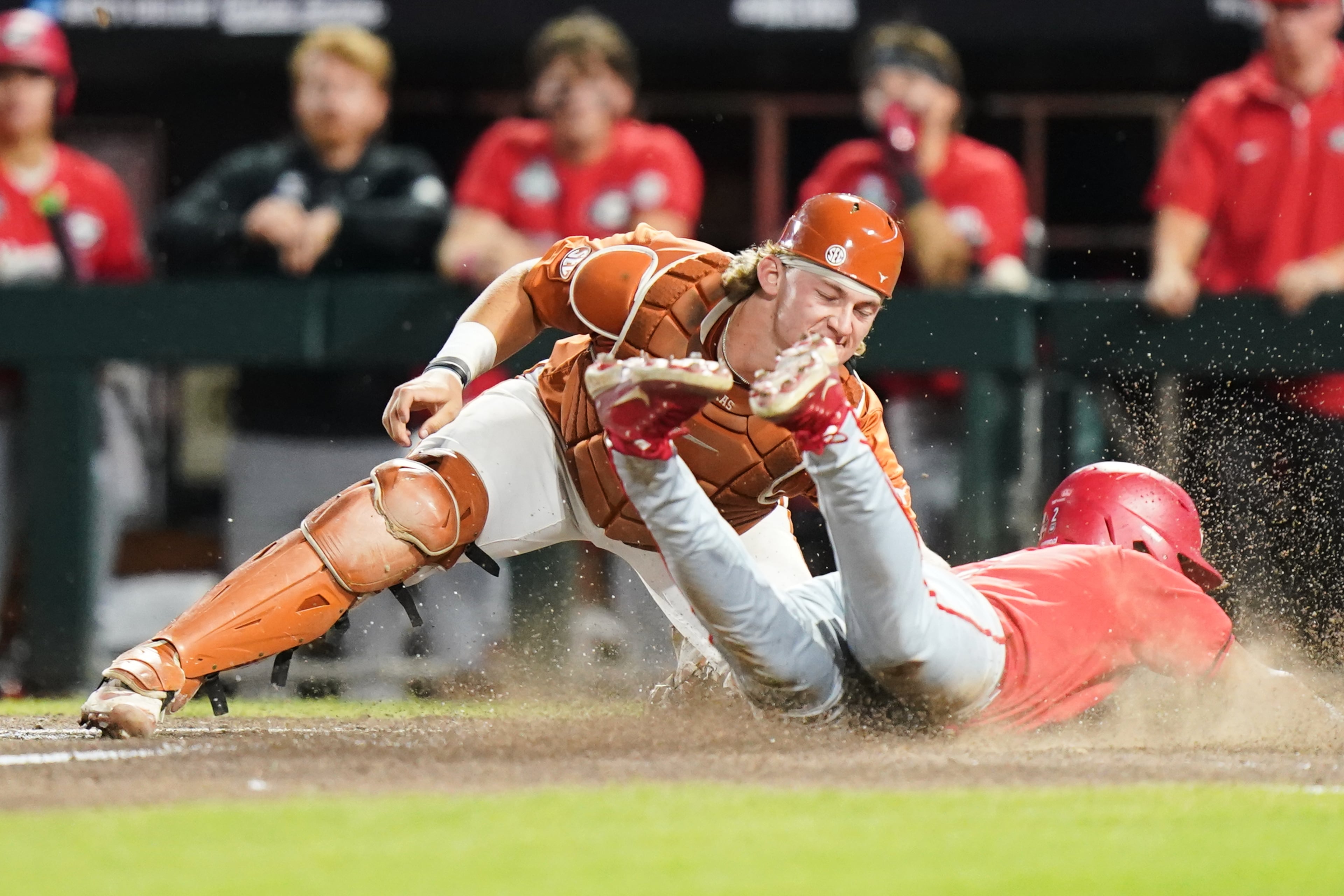 Georgia infielder Ryan Black (2) slides safely into home and scores the second run of the game in the seventh inning during an NCAA baseball College World Series elimination game against Texas, Tuesday, June 16, 2026 in Omaha, Neb. Georgia won 2-0. (AP Photo/Vera Nieuwenhuis)