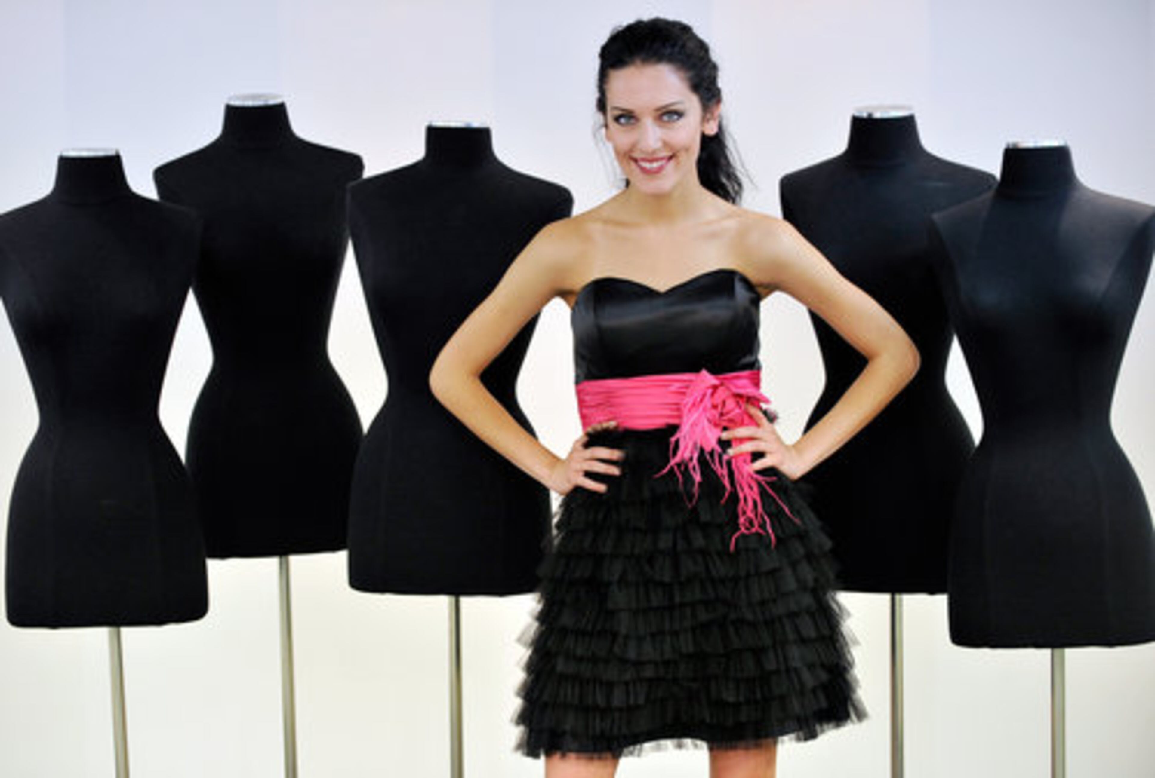 Black is anything but basic when it is a flirty multi-tiered ruffle mini with a bright fuchsia band at the waist. $260 by Tony Bowls.