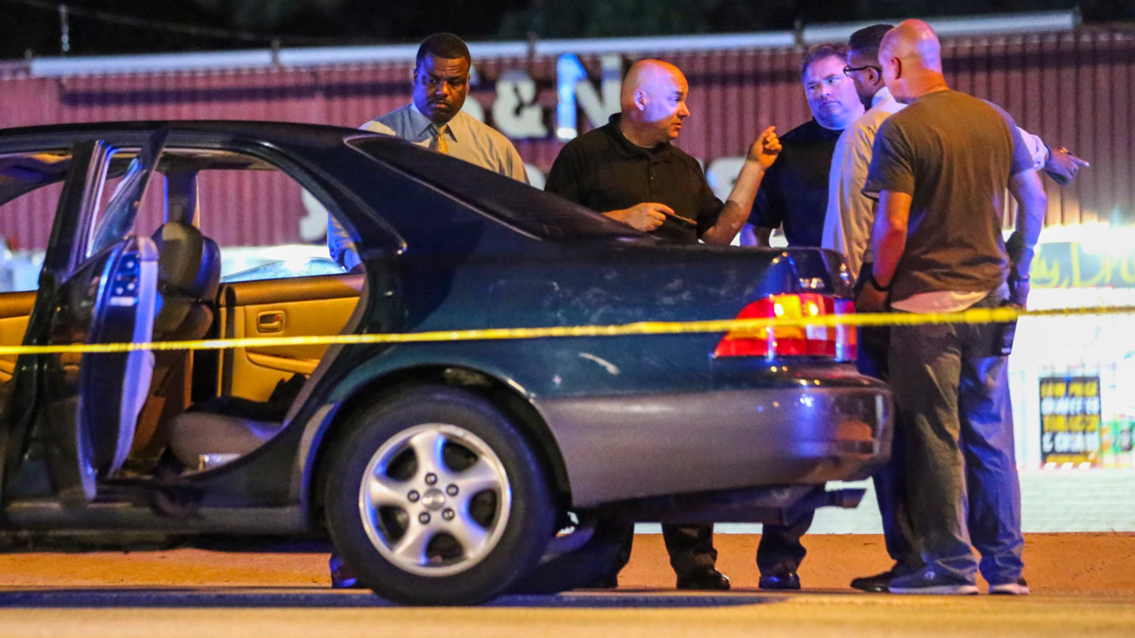 DeKalb police work the scene of a reportedly gang-related shooting that killed a teen girl in August. JOHN SPINK /JSPINK@AJC.COM