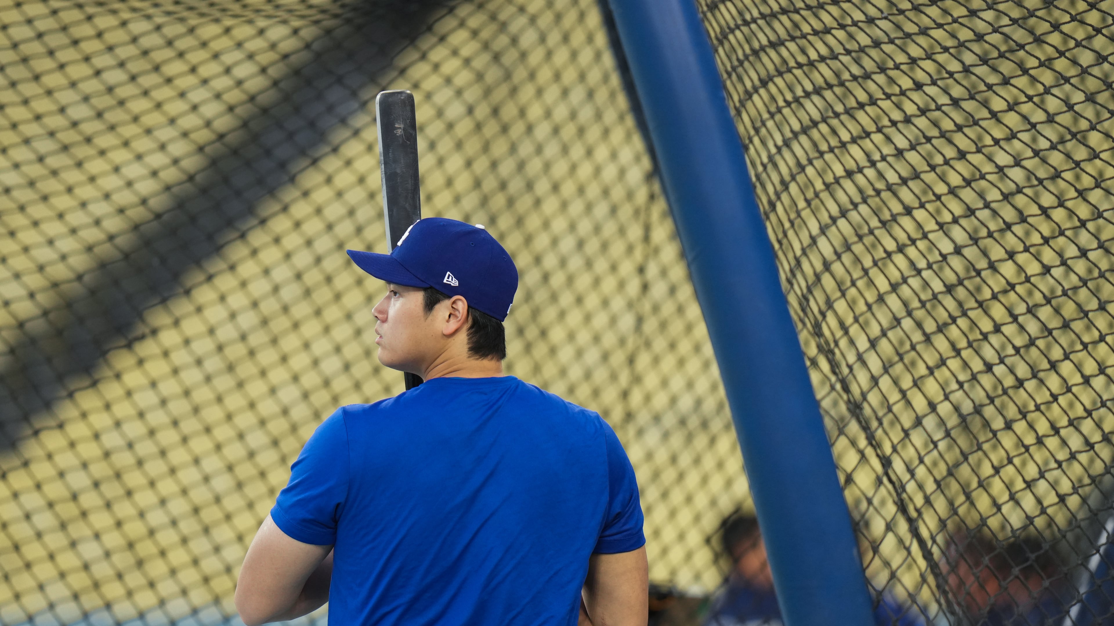 Los Angeles Dodgers' Shohei Ohtani enters the batting cage during a workout ahead of Game 3 of baseball's National League Championship Series against the Milwaukee Brewers, Tuesday, Oct. 13, 2026, in Los Angeles. (AP Photo/Jae C. Hong)