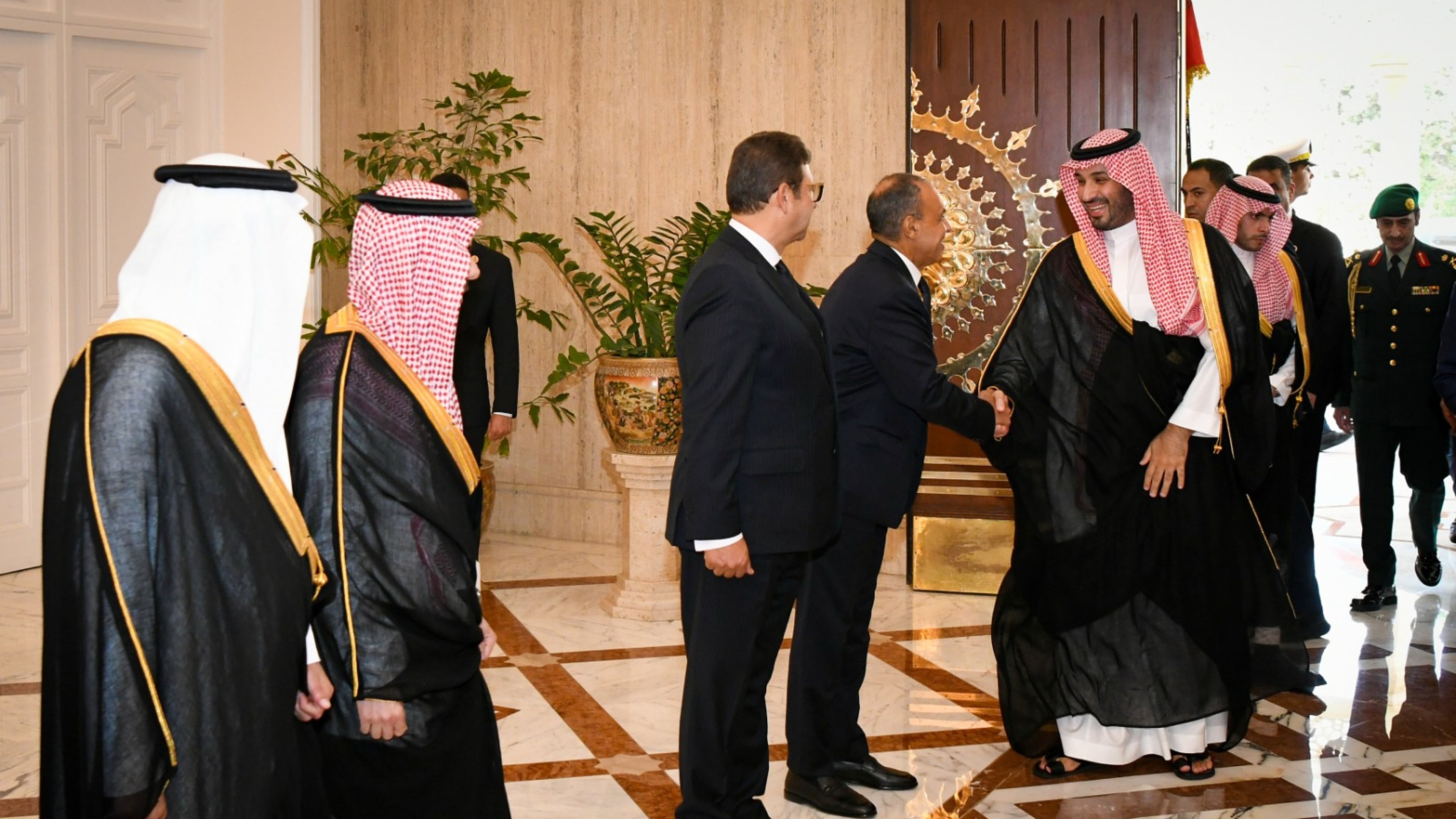 In this photo provided by the Egyptian Presidential Press Office, Saudi Crown Prince Mohammed bin Salman, center right, greets Egyptian officials at the Presidential Palace in Cairo, Egypt, Tuesday, Sept. 15, 2026. (Egyptian Presidential Press Office via AP)