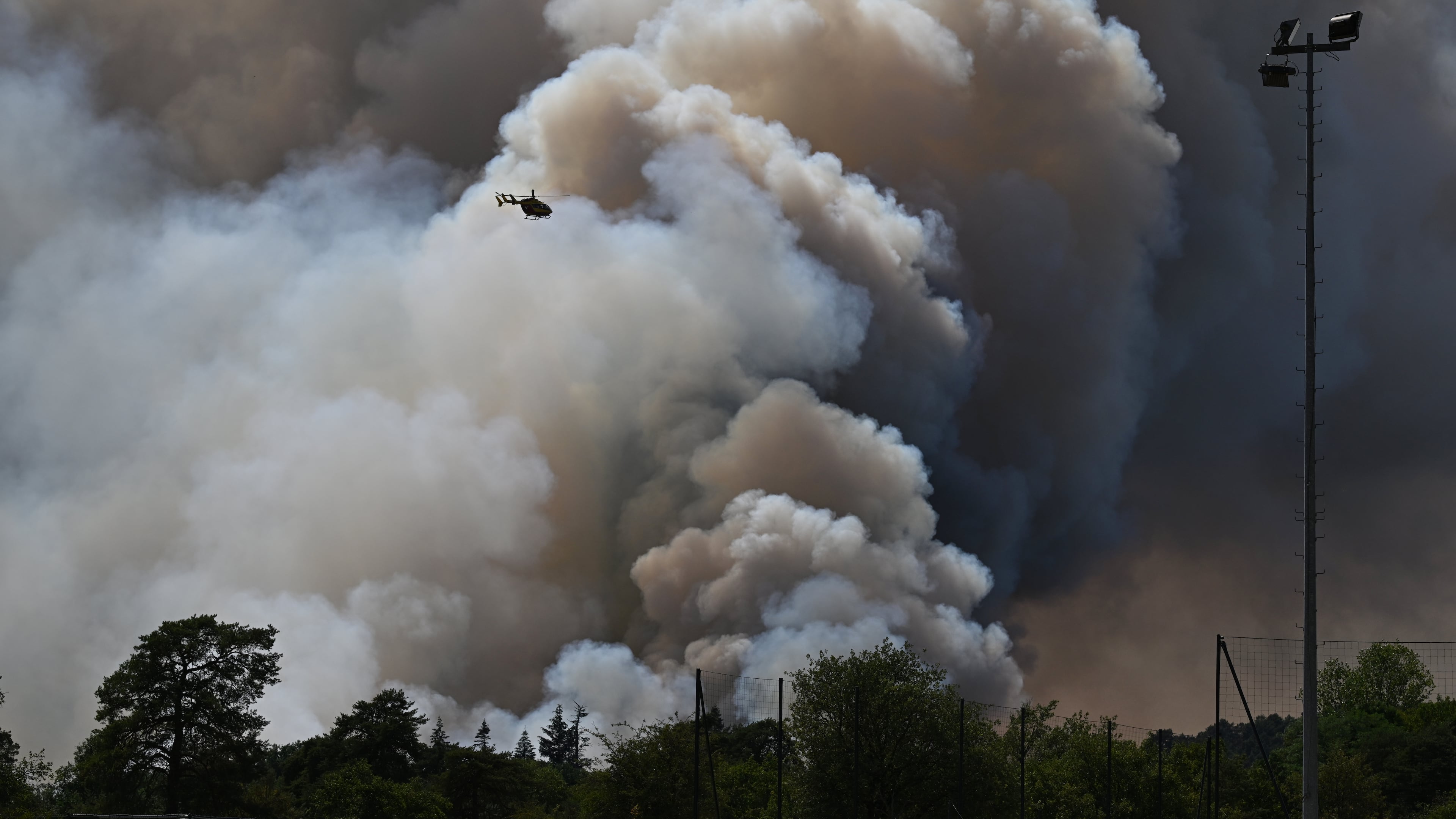 FILE - A pyrocumulonimbus, a giant cloud created by a large wildfire is seen in the Fontainebleau forest region, about 60 kilometers (37 miles) south of Paris, France, Monday, July 13, 2026. (AP Photo/Emma Da Silva, File)