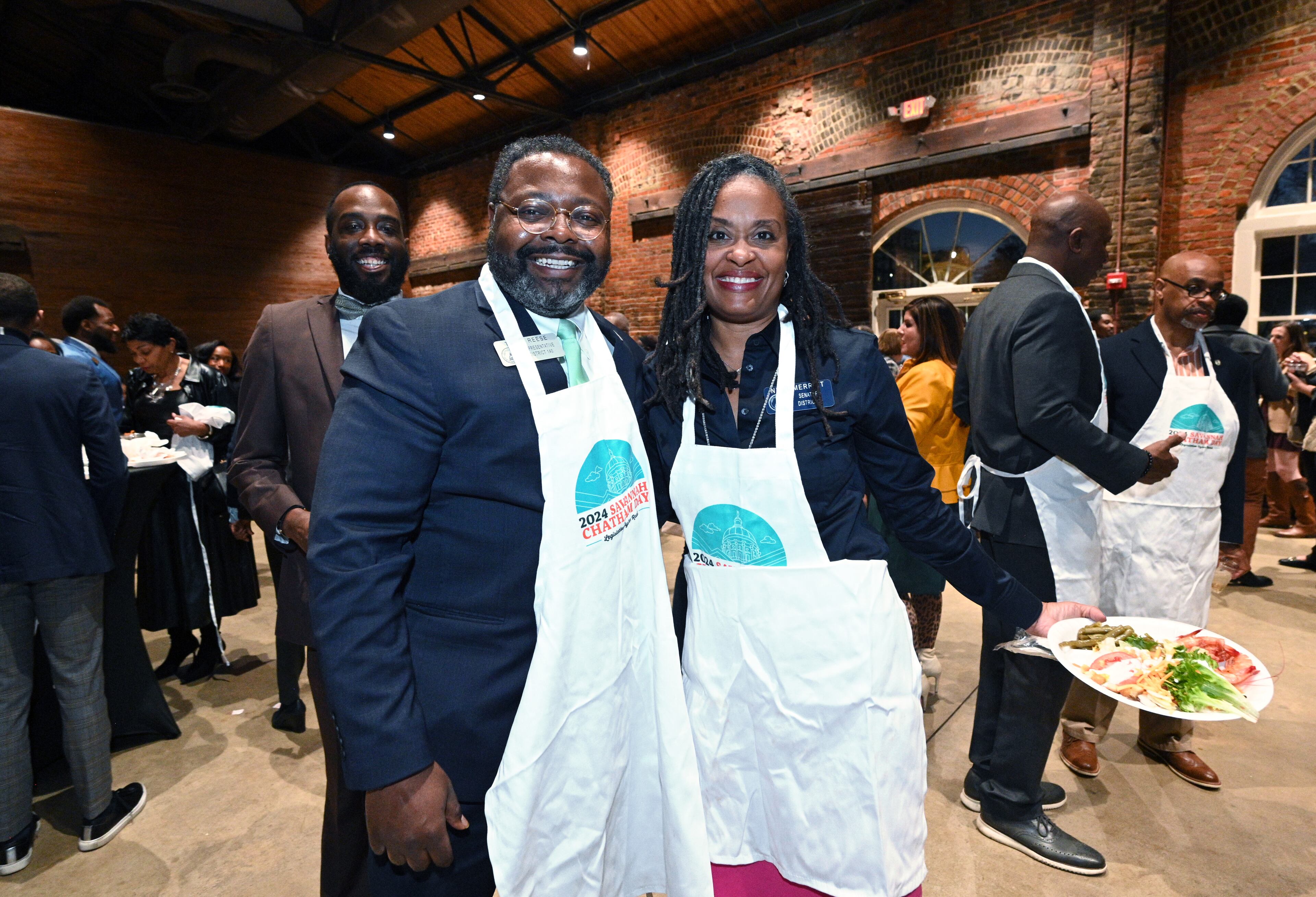 Rep. Tremaine Teddy Reese (left), D - Columbus and Sen. Nikki Merritt, D - Grayson, pose for a photo during Savannah-Chatham Day Legislative Oyster Roast at Georgia Freight Depot, Wednesday, January 31, 2024, in Atlanta. (Hyosub Shin/hyosub.shin@ajc.com)