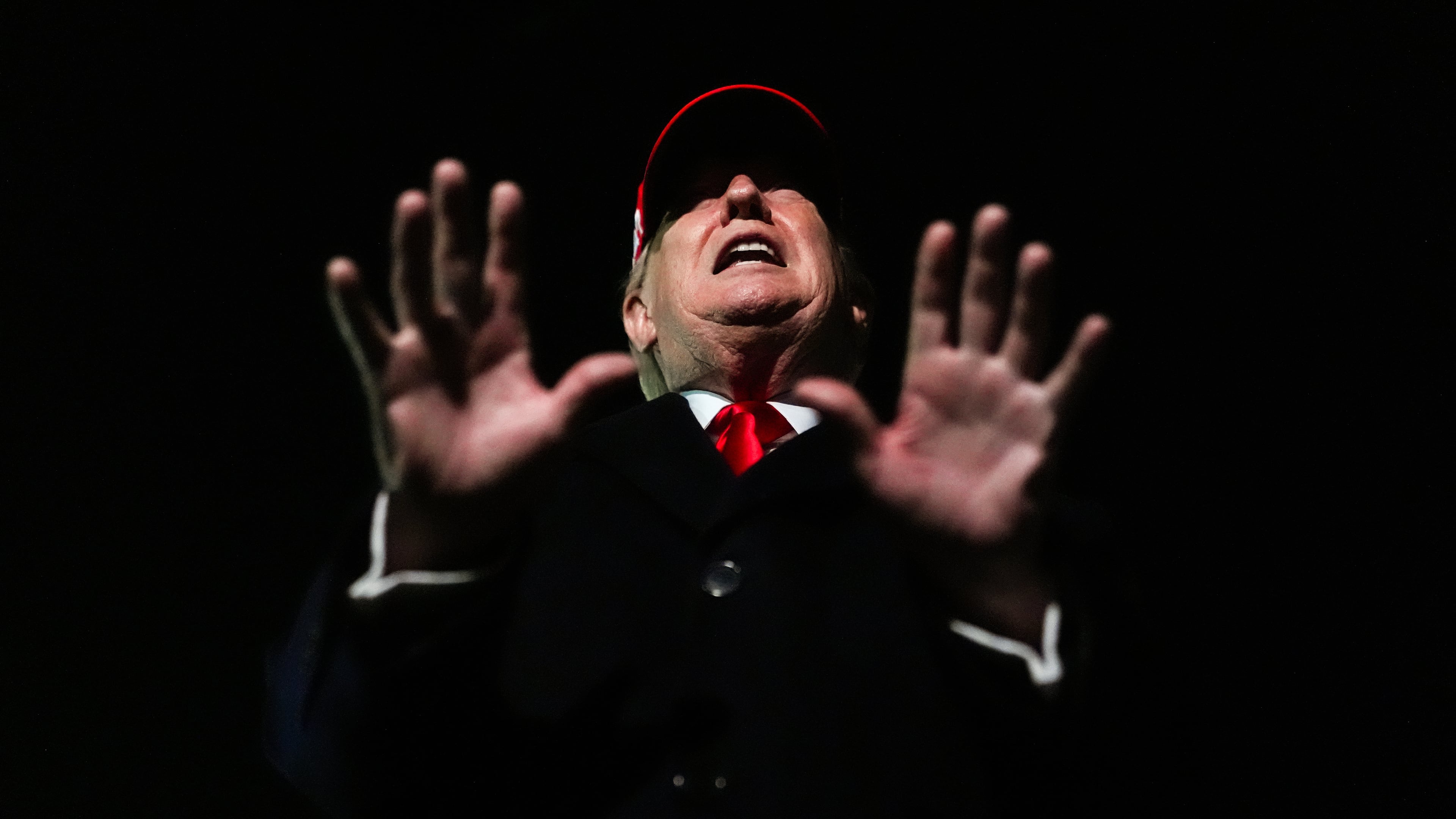 President Donald Trump speaks with reporters after disembarking Air Force One, Sunday, April 12, 2026, at Joint Base Andrews, Md. (AP Photo/Julia Demaree Nikhinson)