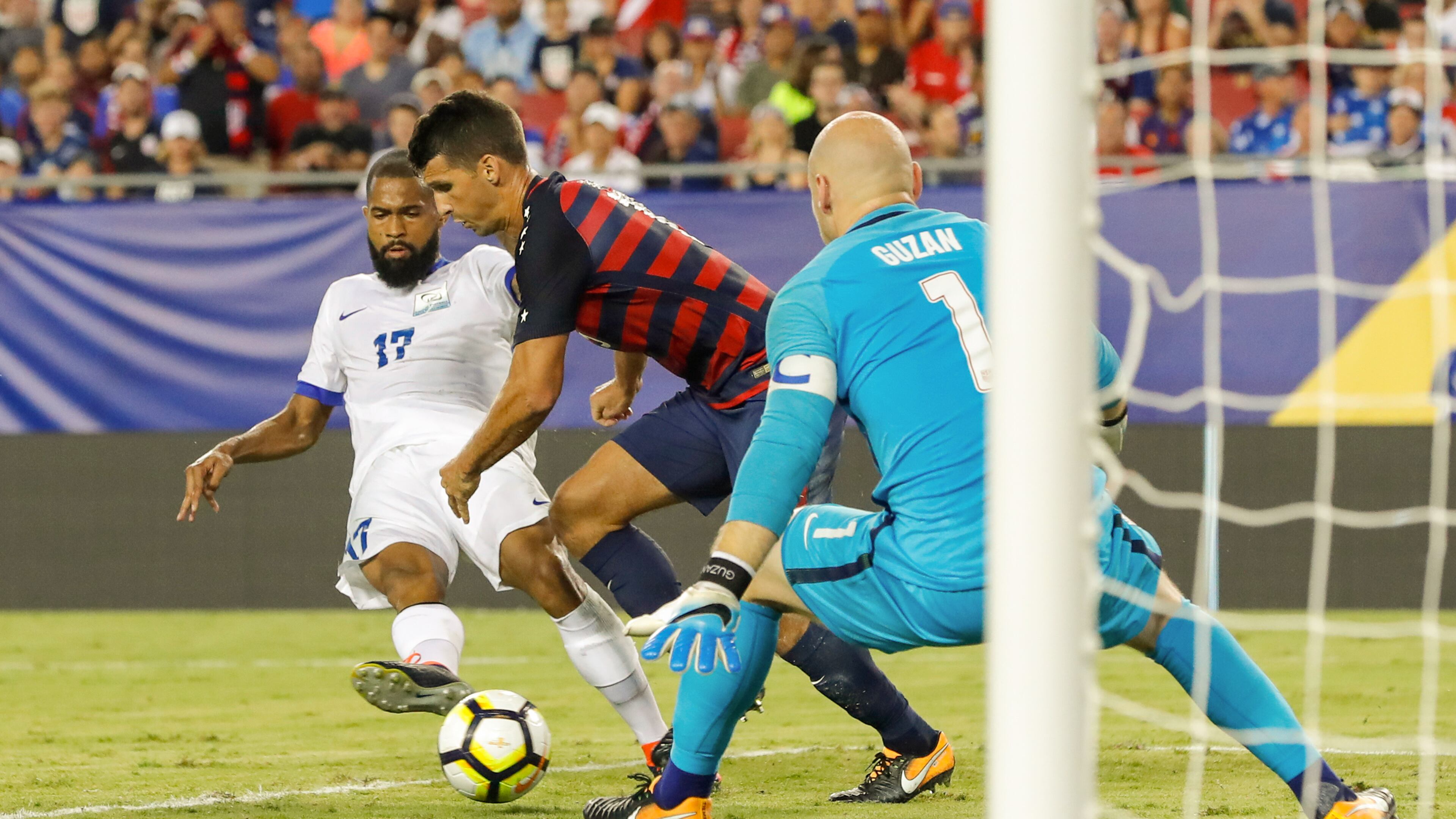 Atlanta United goalkeeper Brad Guzan prepares to make a save as Kevin Parsemain of Martinique shoots against him and the U.S. national men's team during a CONCACAF Group B match at Raymond James Stadium on July 12, 2017 in Tampa, Florida.