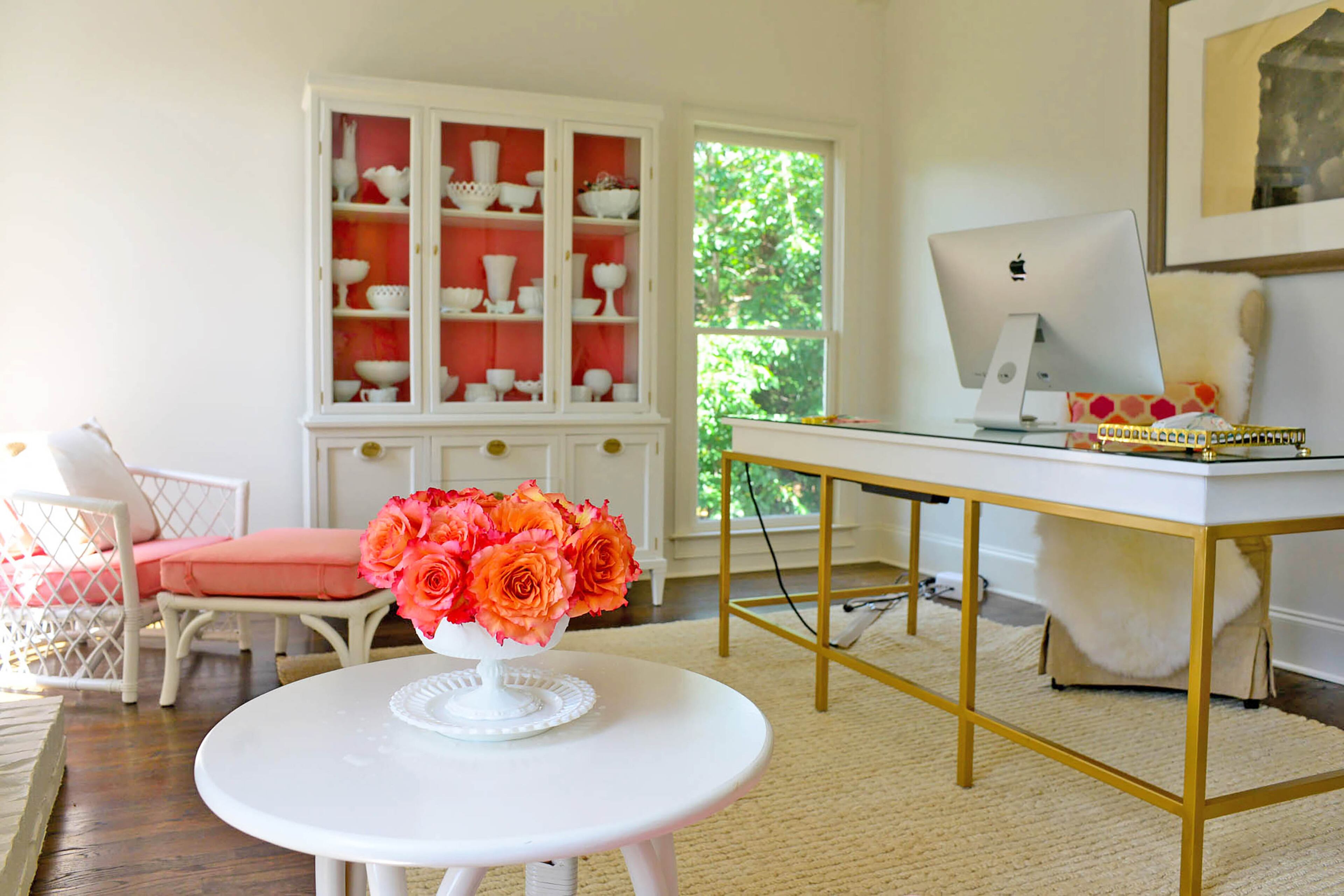 Edee spruced up vintage Ficks Reed club chairs and an antique china cabinet. She added a coat of paint and new cushions to the chairs and a coral background to the cabinet, which was originally brown.