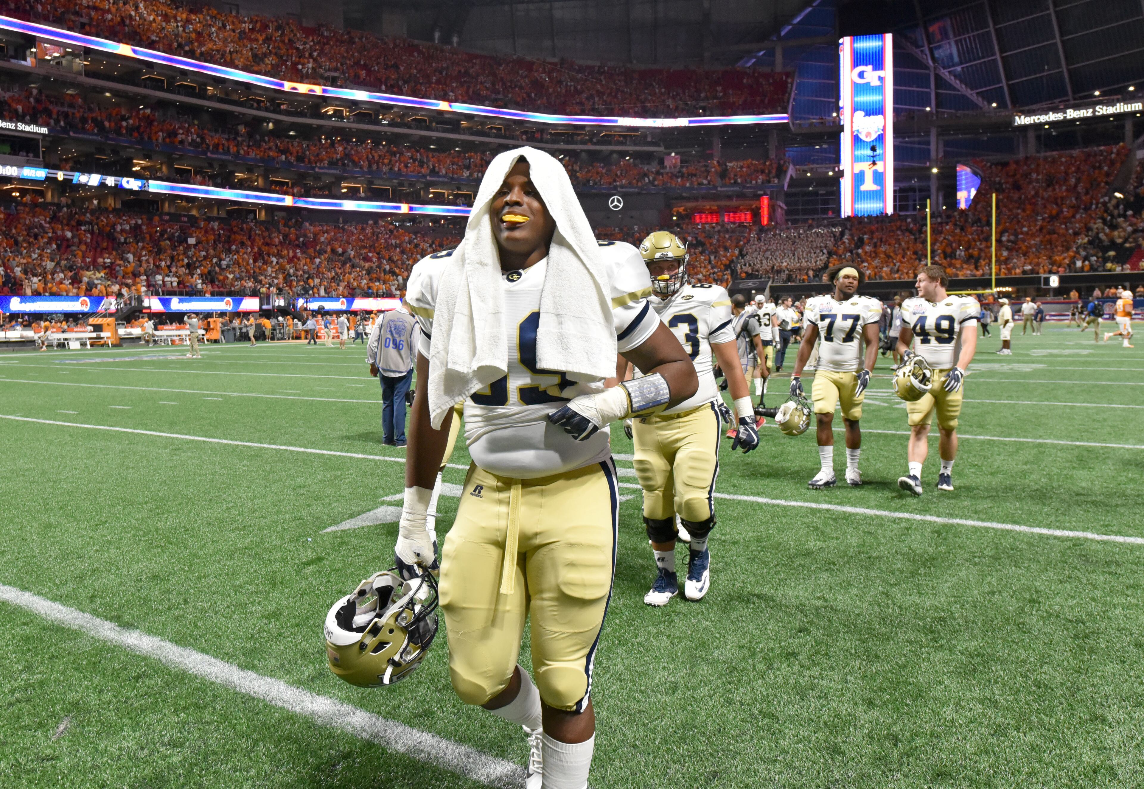 Georgia Tech players react to their loss in double overtime to Tennessee Monday. HYOSUB SHIN / HSHIN@AJC.COM
