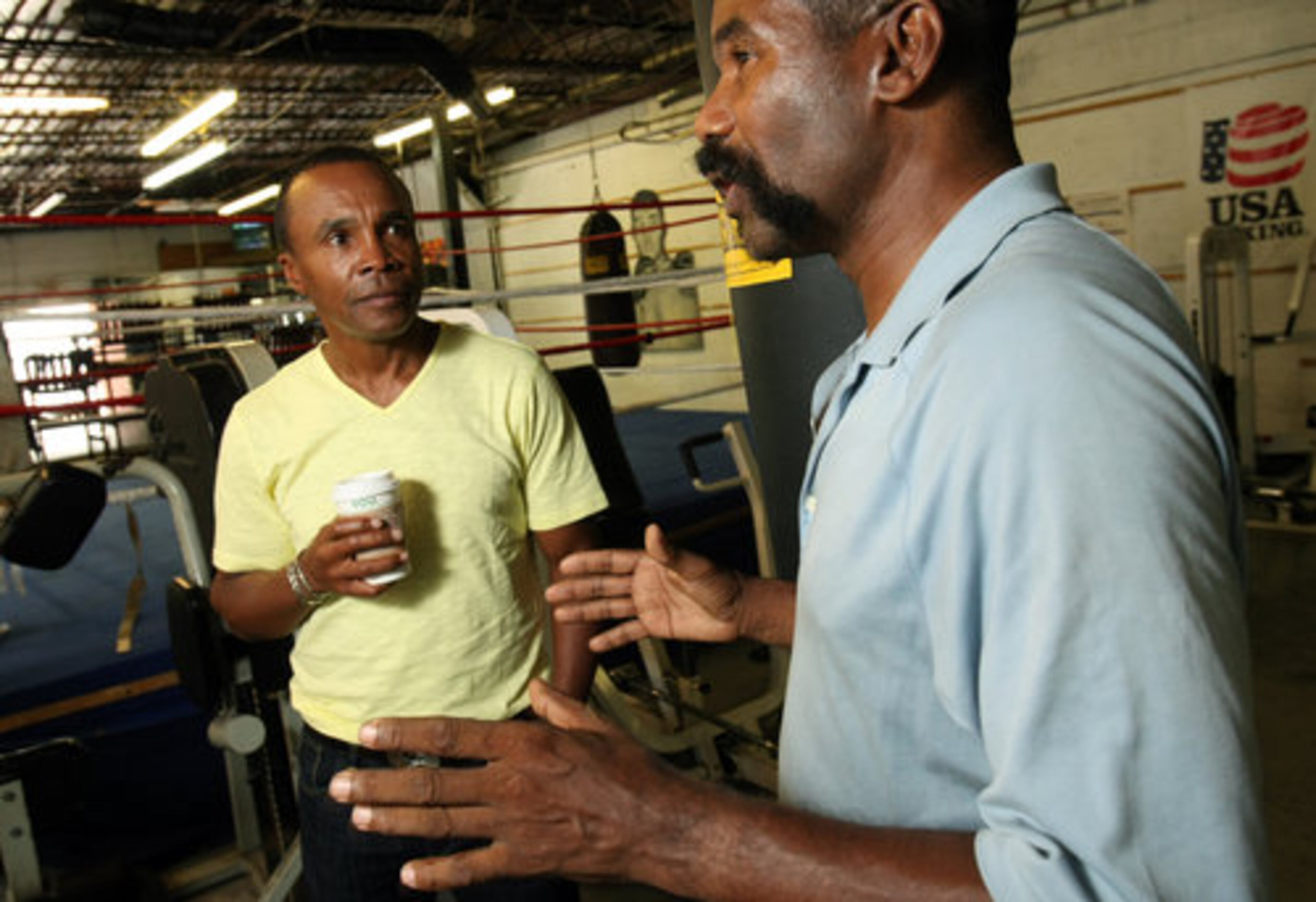 Sugar Ray Leonard reminisces with Johnny Gant (right) at the Atlanta Art of Boxing center in Midtown on Friday, June 10, 2011. The two fought in 1979 in the Mid-Atlantic Welterweight Championship.