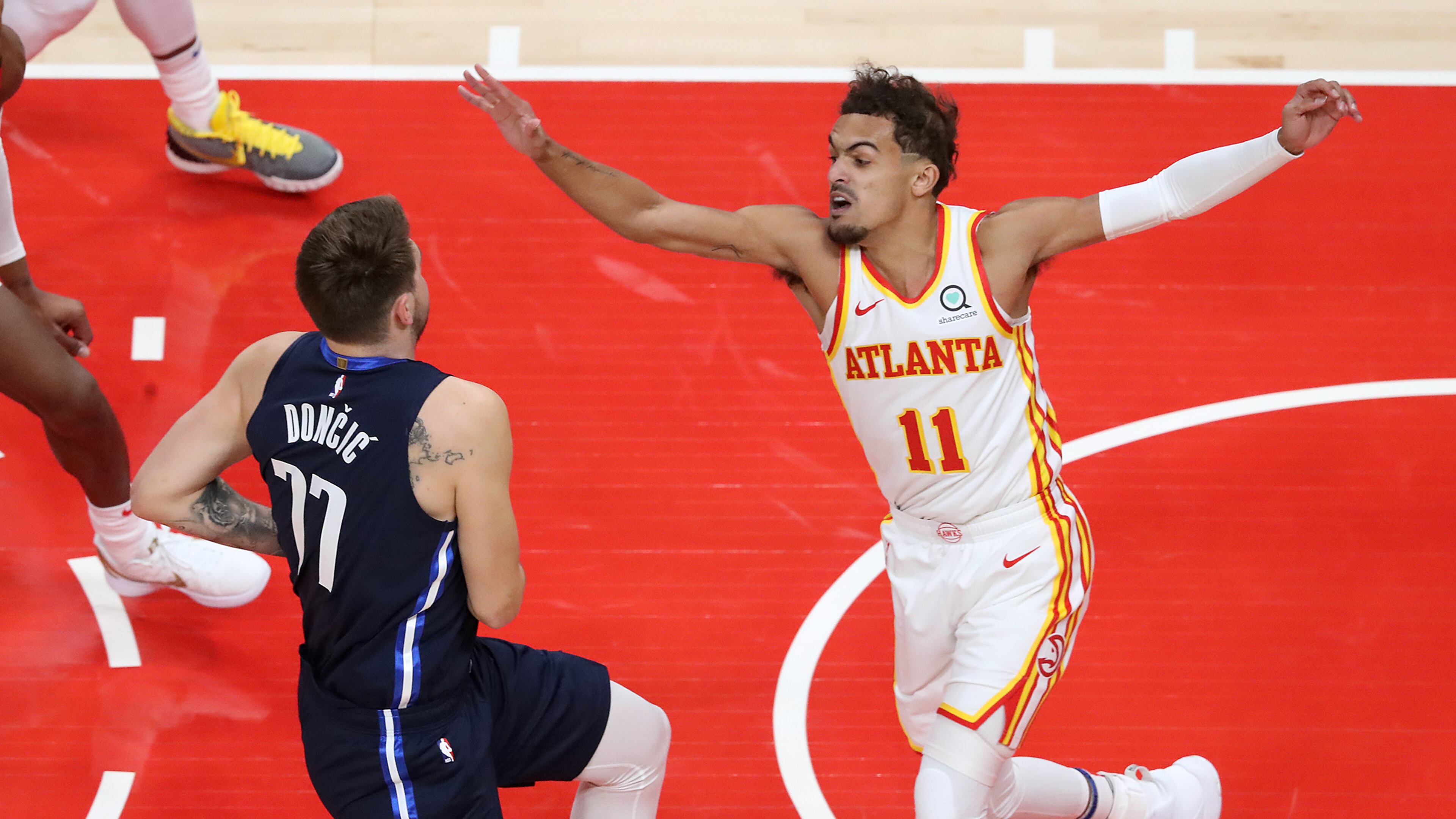 020321 Atlanta: Atlanta Hawks guard Trae Young defends against Dallas Mavericks guard Luka Doncic during an NBA basketball game on Wednesday, Feb 3, 2021, in Atlanta. Curtis Compton / Curtis.Compton@ajc.com”