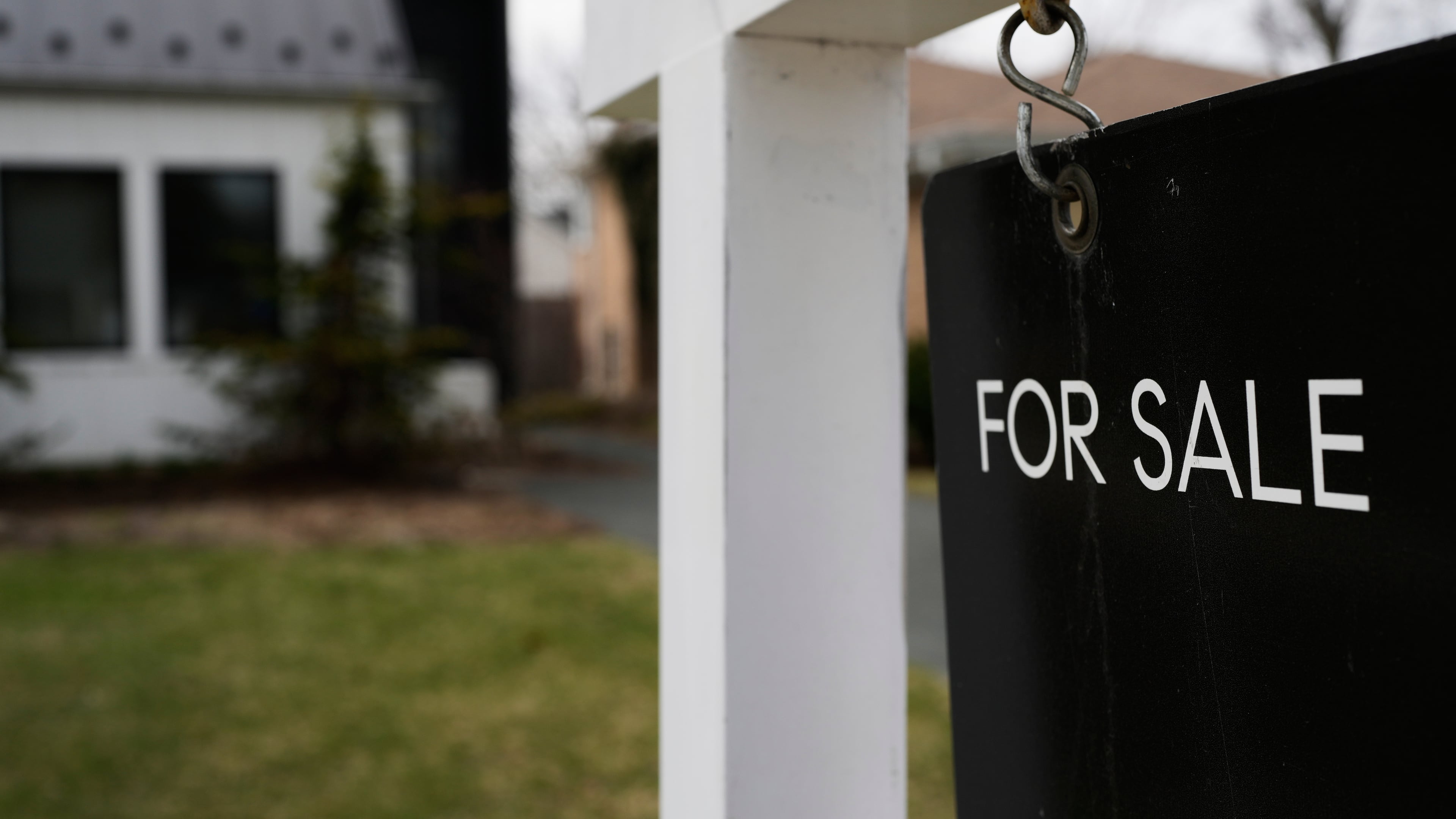 FILE - A House For Sale sign is displayed in front of a home in Evanston, Ill., Wednesday, March 25, 2026. (AP Photo/Nam Y. Huh, File)