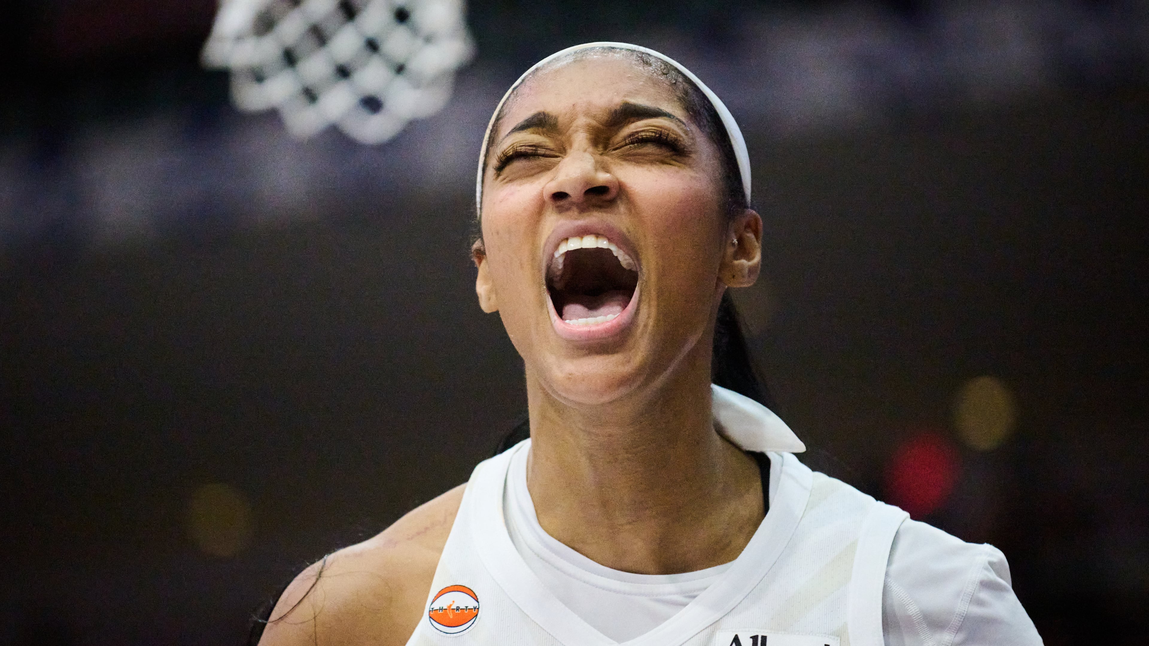 Atlanta Dream's Angel Reese reacts after scoring against the Toronto Tempo during the second half of a WNBA basketball game in Toronto, on Sunday, June 14, 2026. (Sammy Kogan/The Canadian Press via AP)
