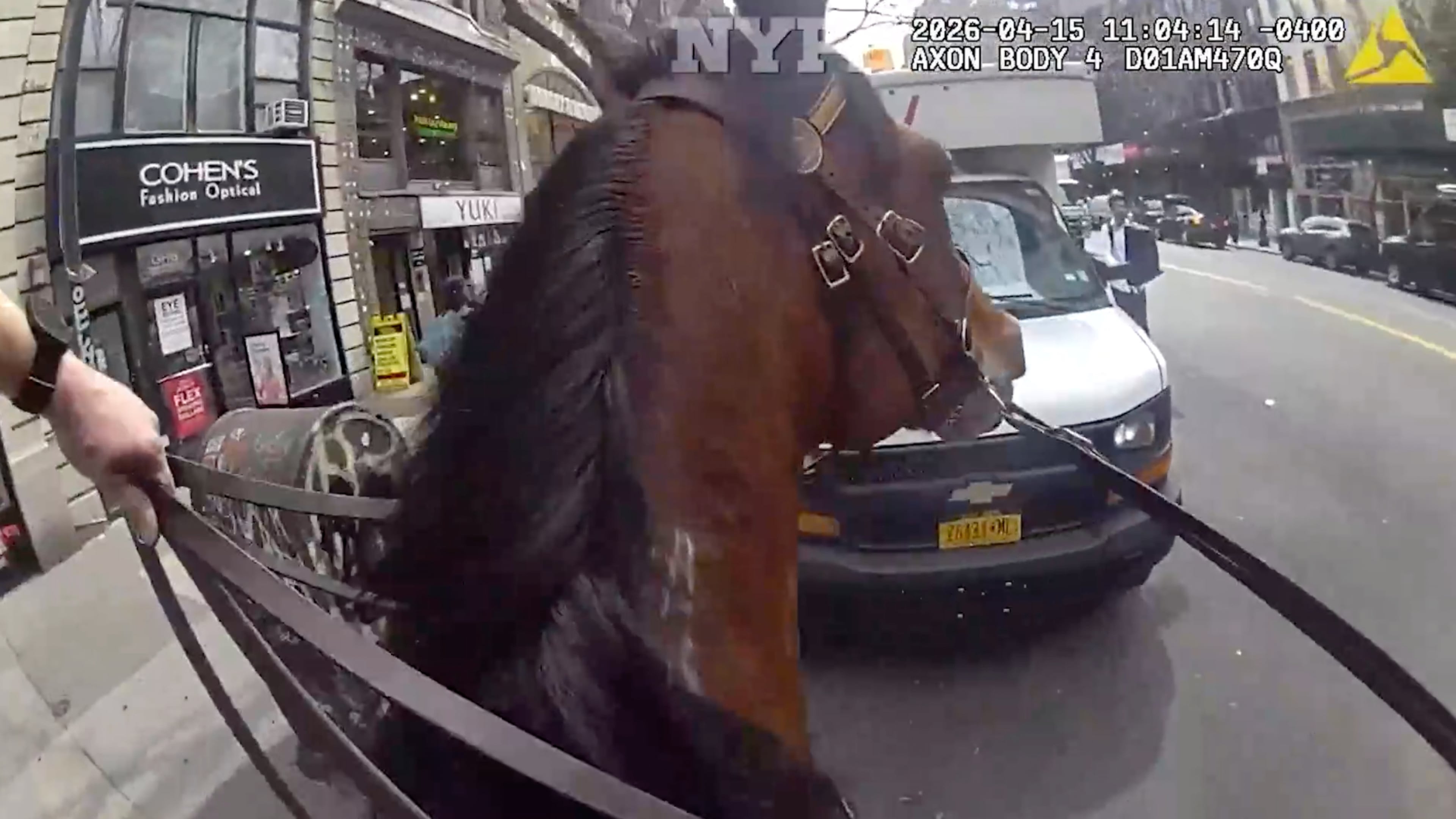 This image taken from NYPD Bodycam shows an NYPD police officer on horseback chasing an alleged purse theft on Wednesday, April 15, 2026 in New York. (NYPD via AP)