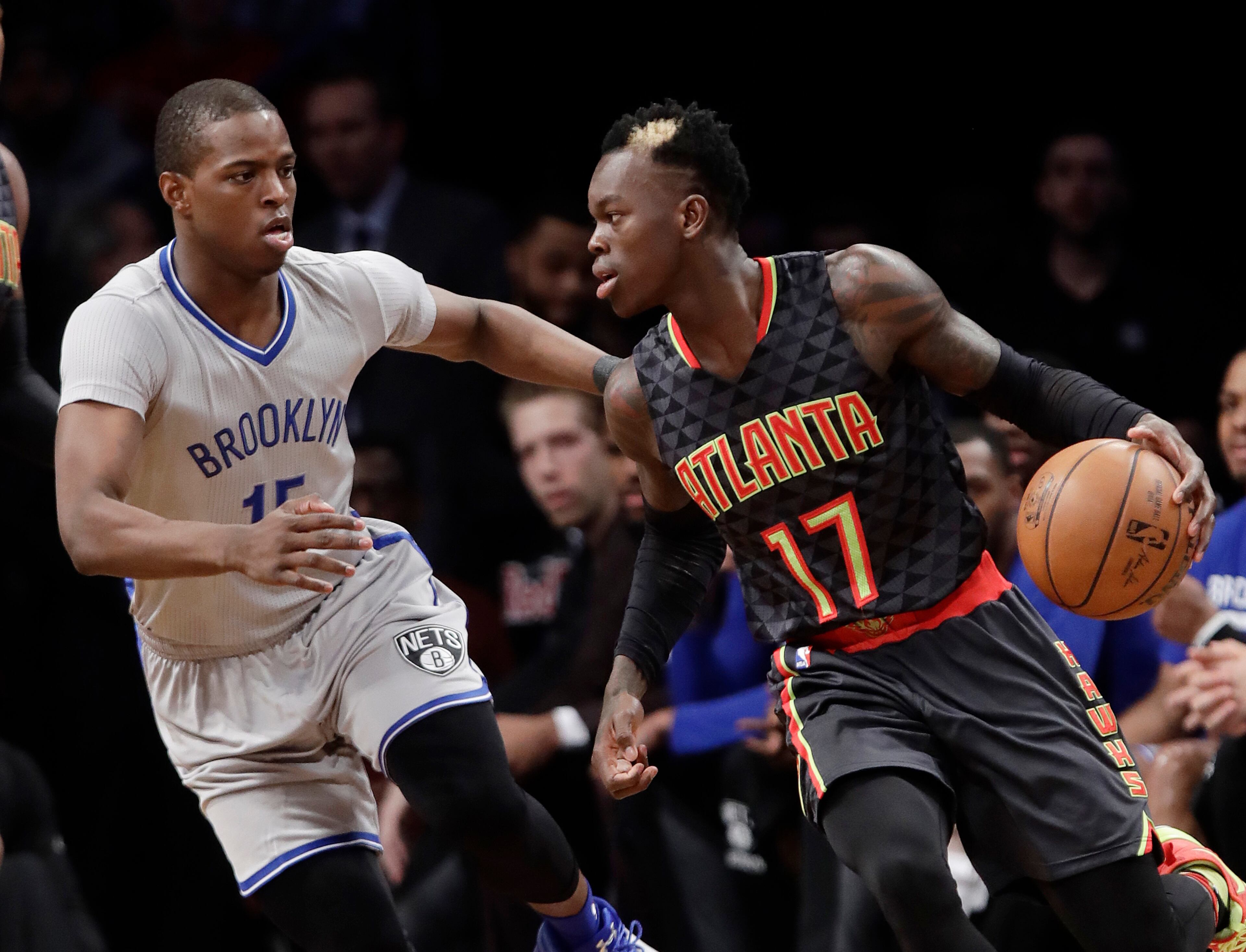 Brooklyn Nets' Isaiah Whitehead (15) defends Atlanta Hawks' Dennis Schroder (17), of Germany, during the first half of an NBA basketball game Tuesday, Jan. 10, 2017, in New York. (AP Photo/Frank Franklin II)