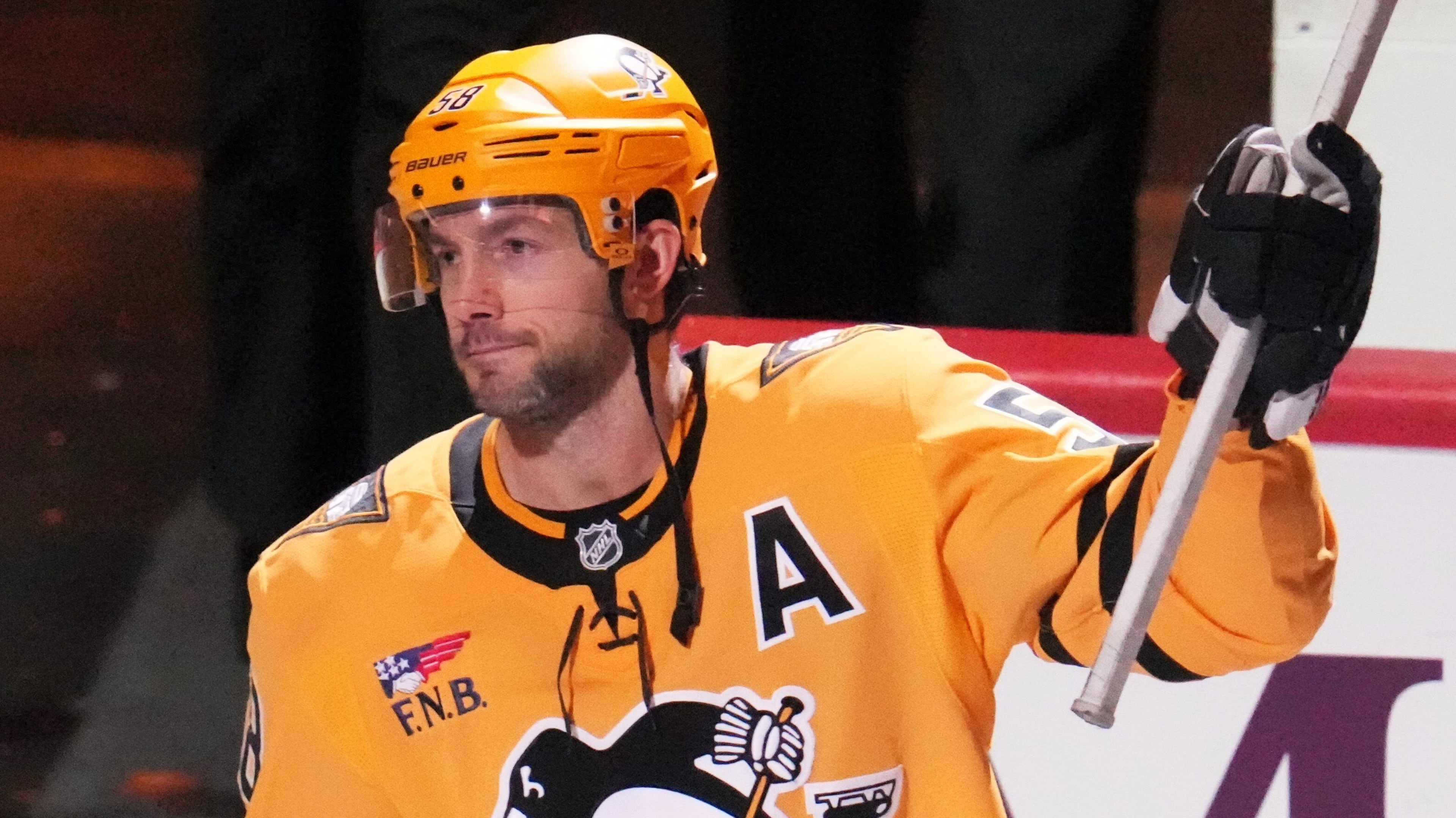 Pittsburgh Penguins' Kris Letang acknowledges being named the games number one start after scoring the gamin-winning goal in the overtime period of an NHL hockey game against the Detroit Red Wings in Pittsburgh, Thursday, Jan. 1, 2026. (AP Photo/Gene J. Puskar)