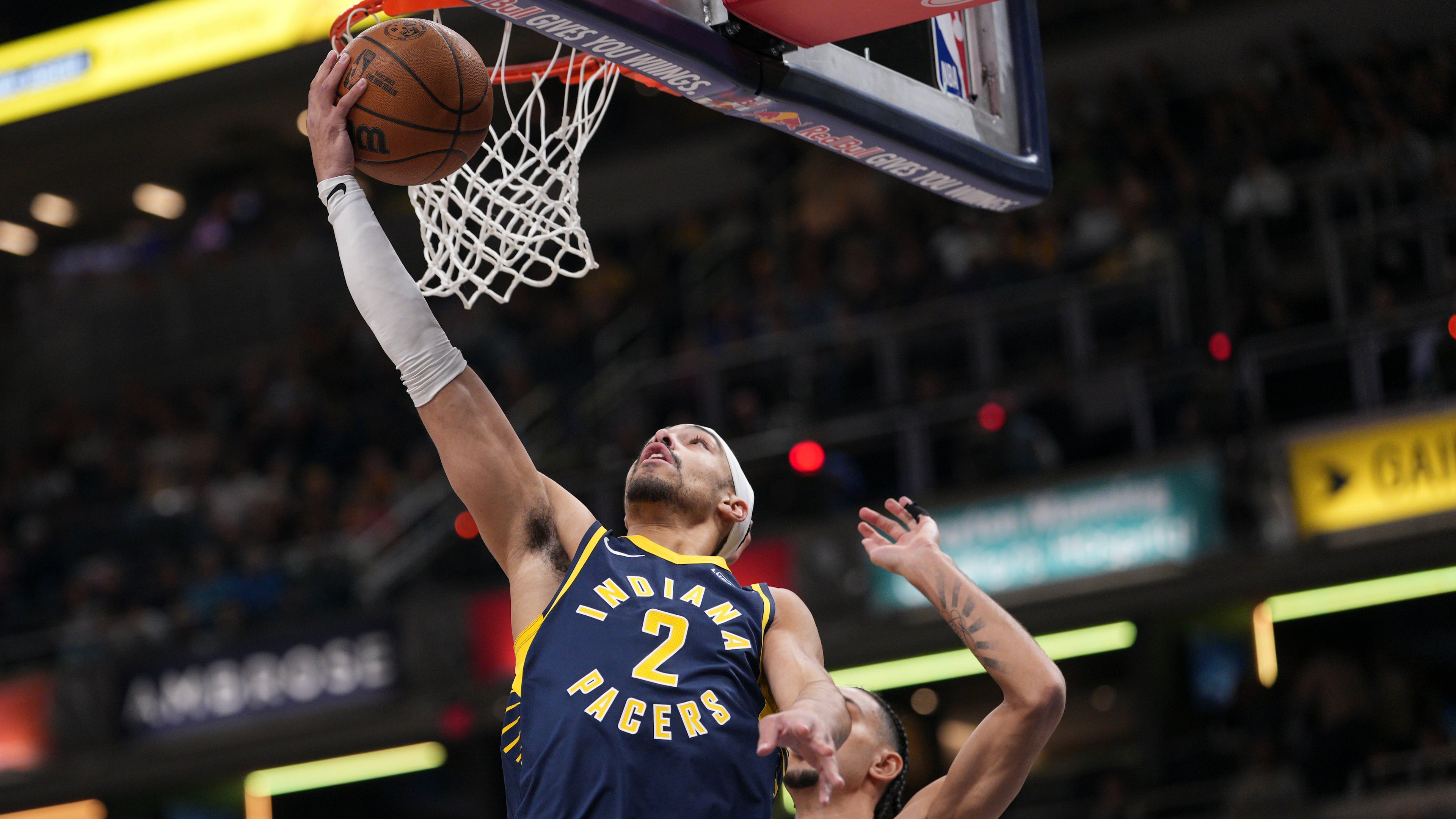 Indiana Pacers guard Andrew Nembhard, left, shoots in front of Atlanta Hawks forward Zaccharie Risacher during the first half of an NBA basketball game in Indianapolis, Saturday, Jan. 31, 2026. (AP Photo/AJ Mast)