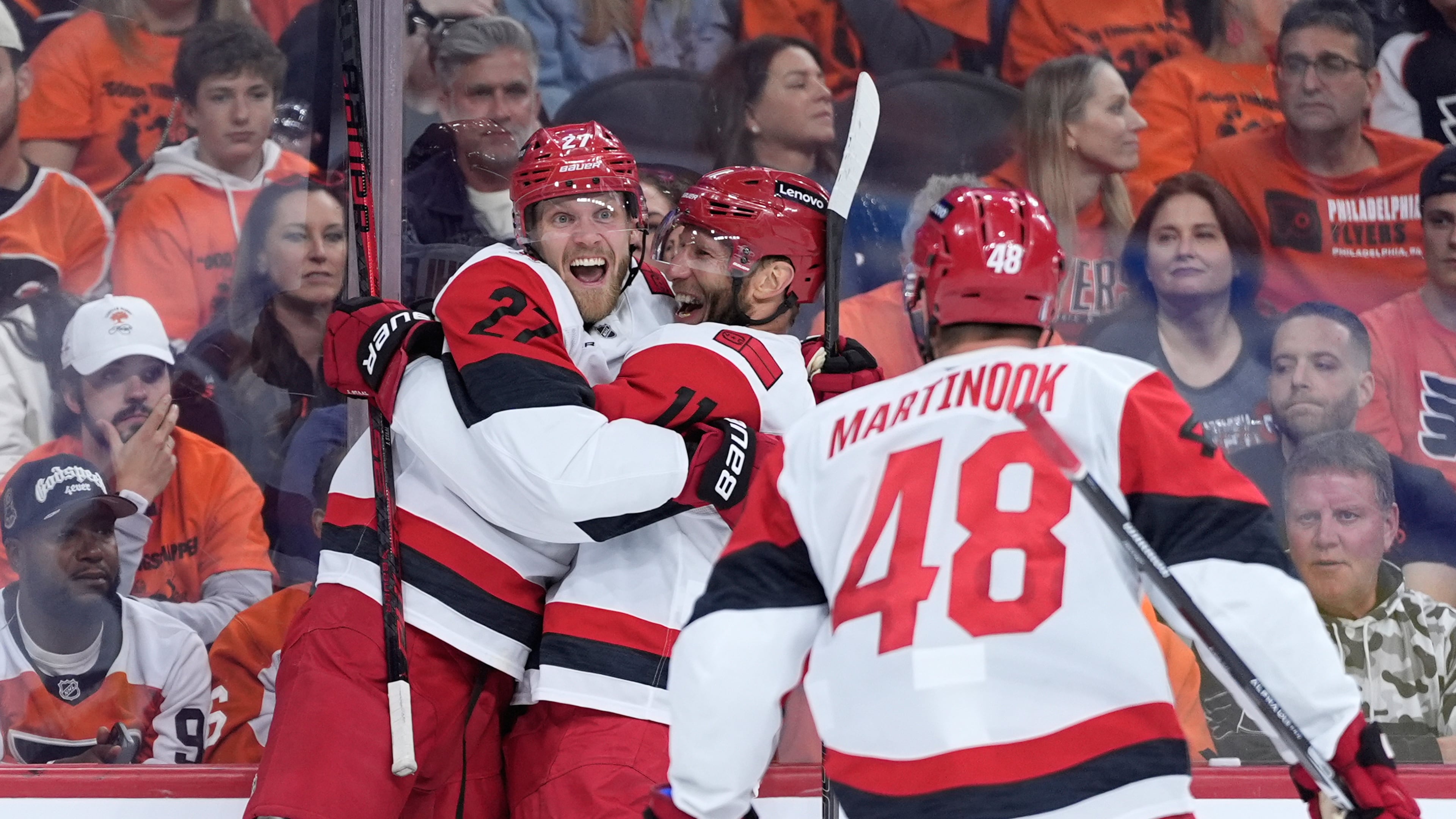 Carolina Hurricanes' Nikolaj Ehlers, from left, Jordan Staal and Jordan Martinook celebrate after a goal by Ehlers during the third period of Game 3 in the second round of the NHL hockey Stanley Cup playoffs against the Philadelphia Flyers Thursday, May 7, 2026, in Philadelphia. (AP Photo/Matt Slocum)