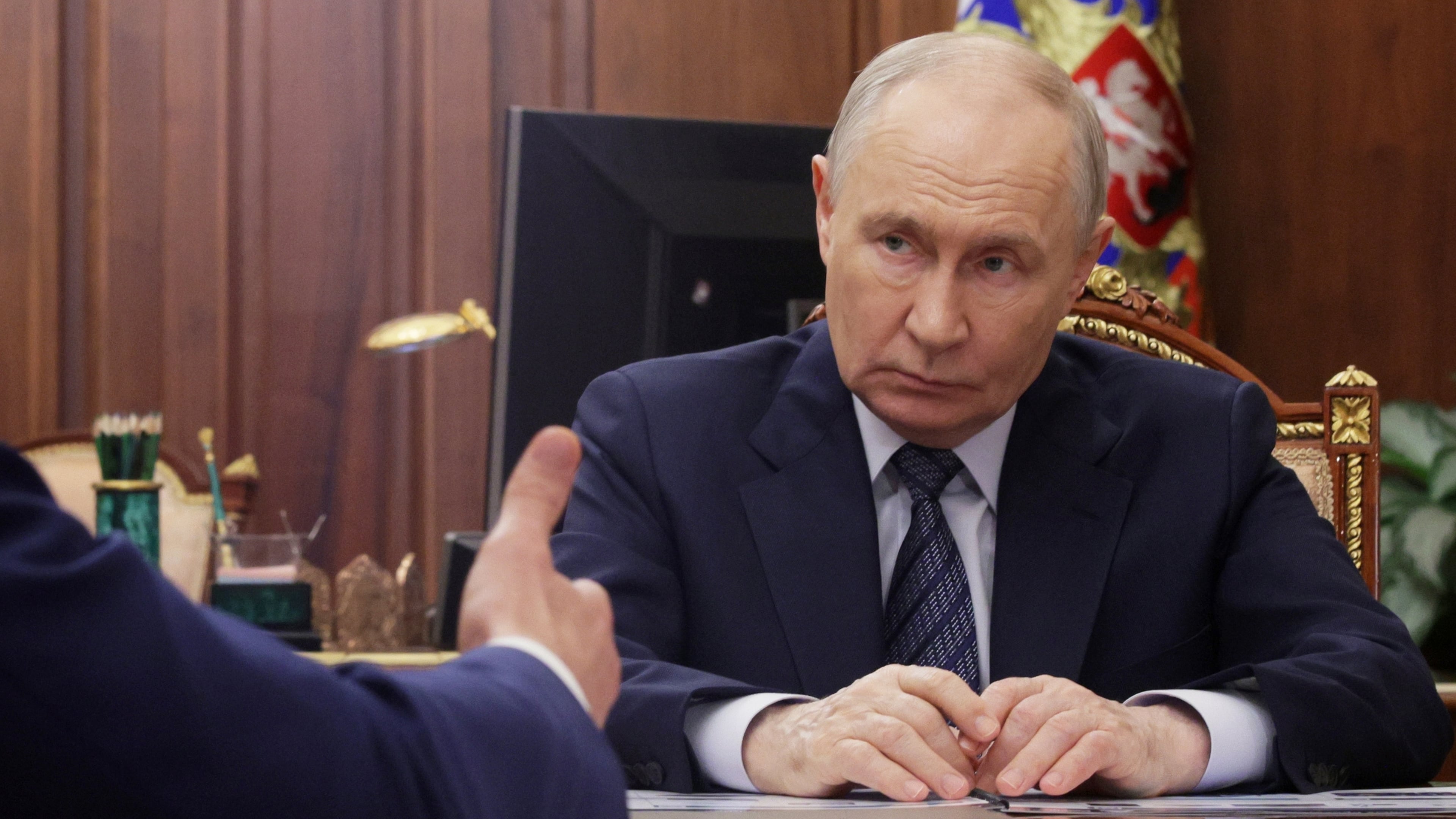 Russian President Vladimir Putin listens to Minister of Industry and Trade Anton Alikhanov during their meeting at the Kremlin in Moscow, Wednesday, Aug. 26, 2026. (Mikhail Metzel, Sputnik, Kremlin Pool Photo via AP)