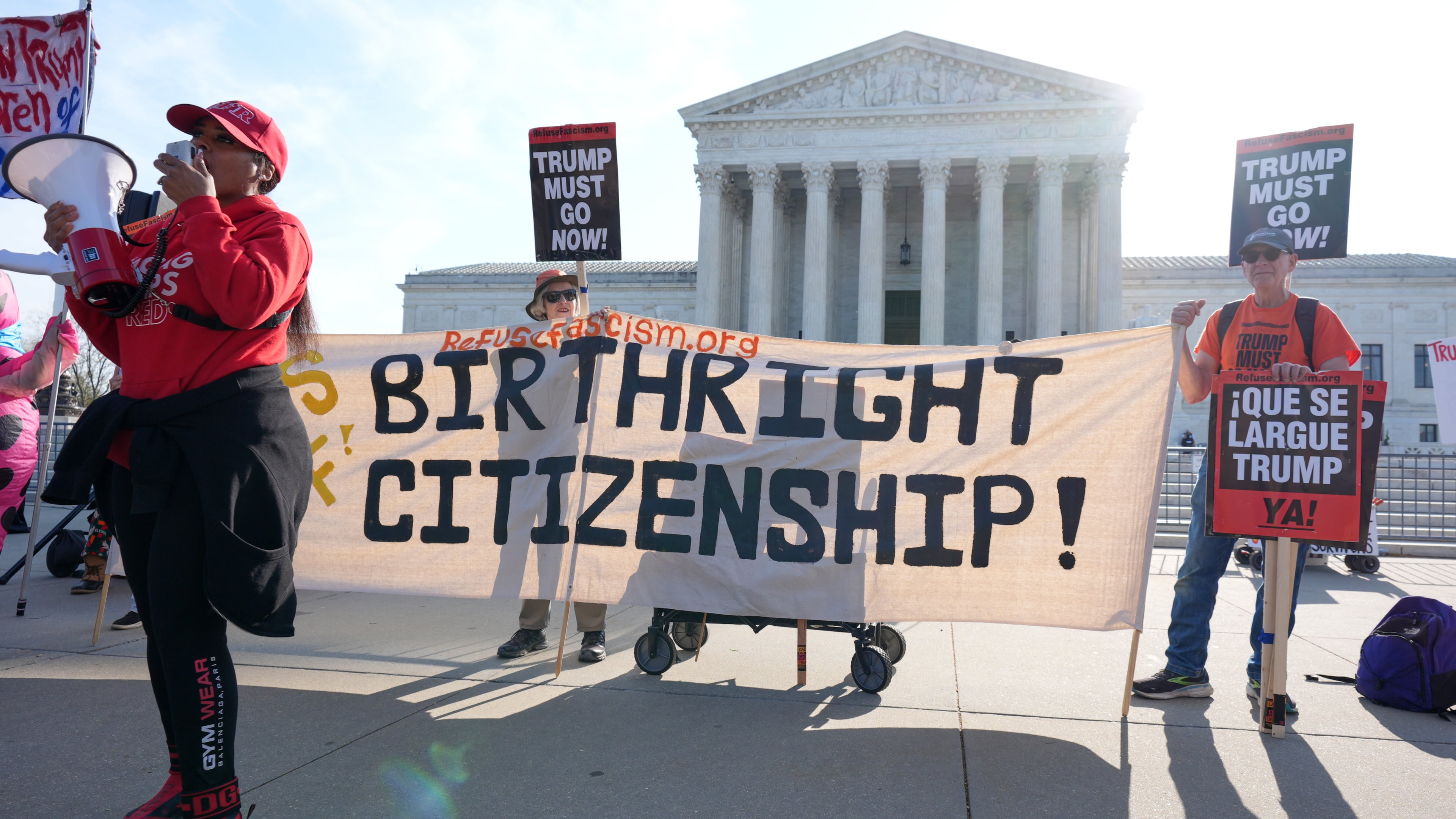Pro and anti-Trump demonstrators rally outside the U.S. Supreme Court, before justices hear oral arguments on whether President Donald Trump can deny citizenship to children born to parents who are in the United States illegally or temporarily, on Capitol Hill, in Washington, Wednesday, April 1, 2026. (AP Photo/J. Scott Applewhite)