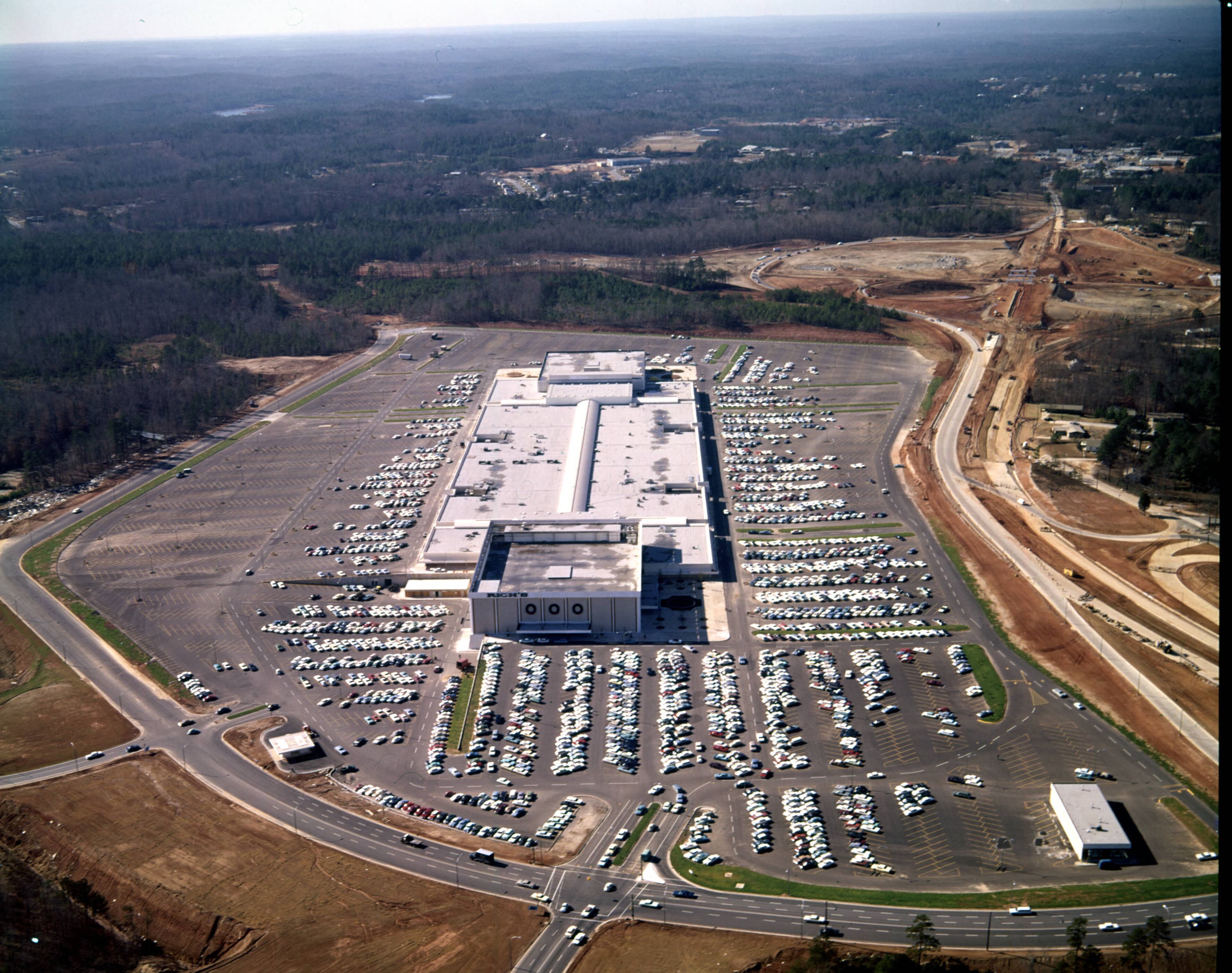 Aerial view of Greenbriar Center (later, Greenbriar Mall) and its surrounding parking lot, looking west, Atlanta, Georgia, December 21, 1965. Greenbriar Center opened earlier in 1965.