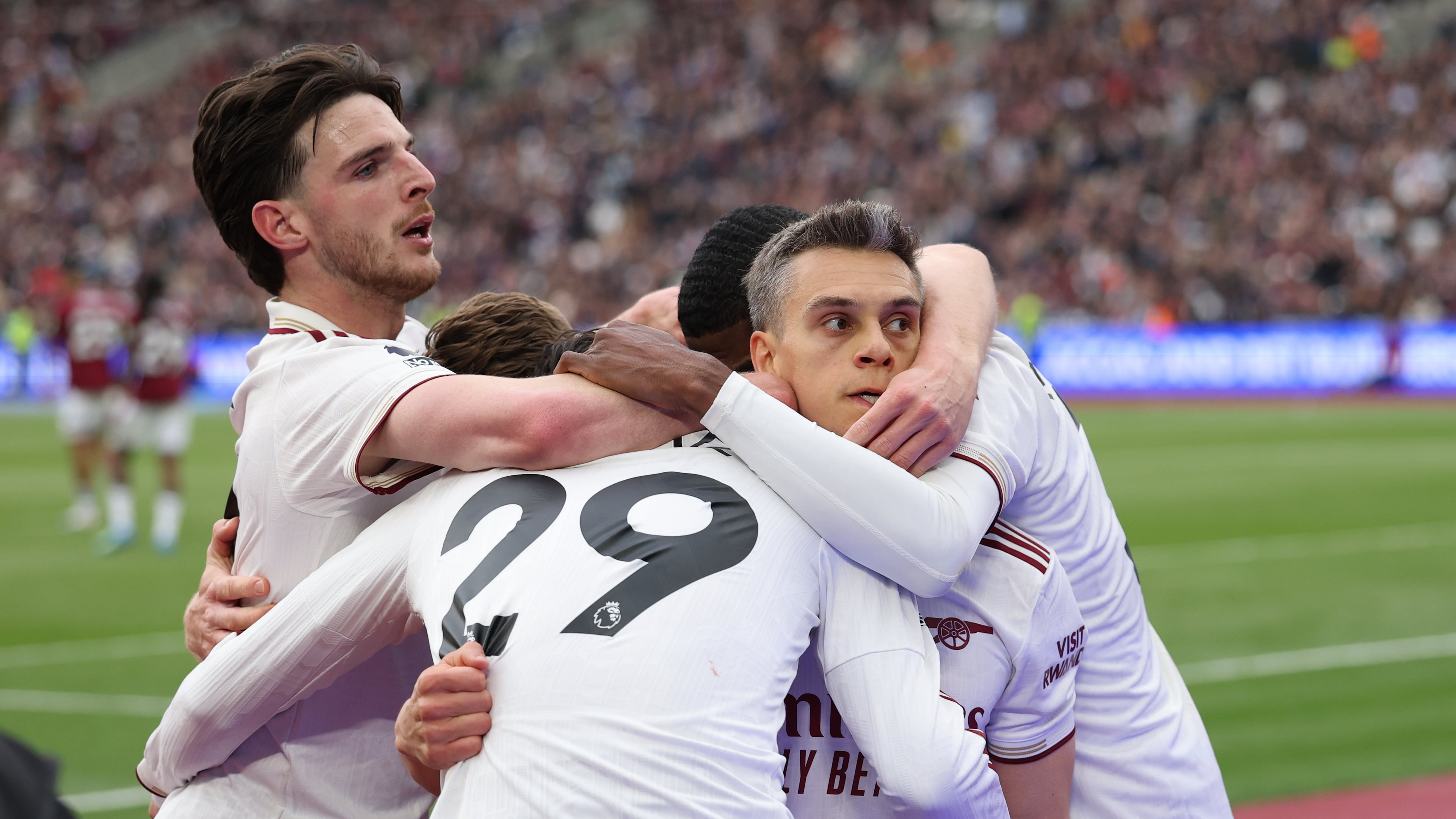 Arsenal players celebrate after scoring during the Premier League soccer match between West Ham and Arsenal in London, Sunday, May 10, 2026. (AP Photo/Ian Walton)