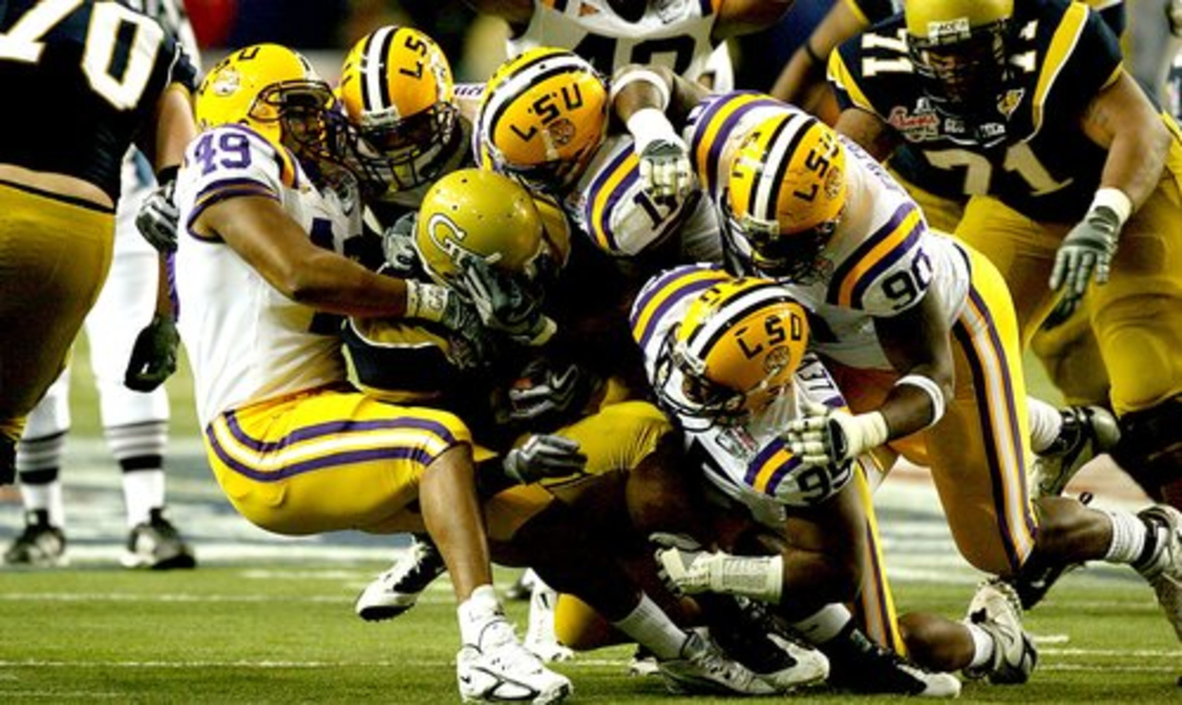 Tech's Jonathan Dwyer meets a wall of LSU defenders.