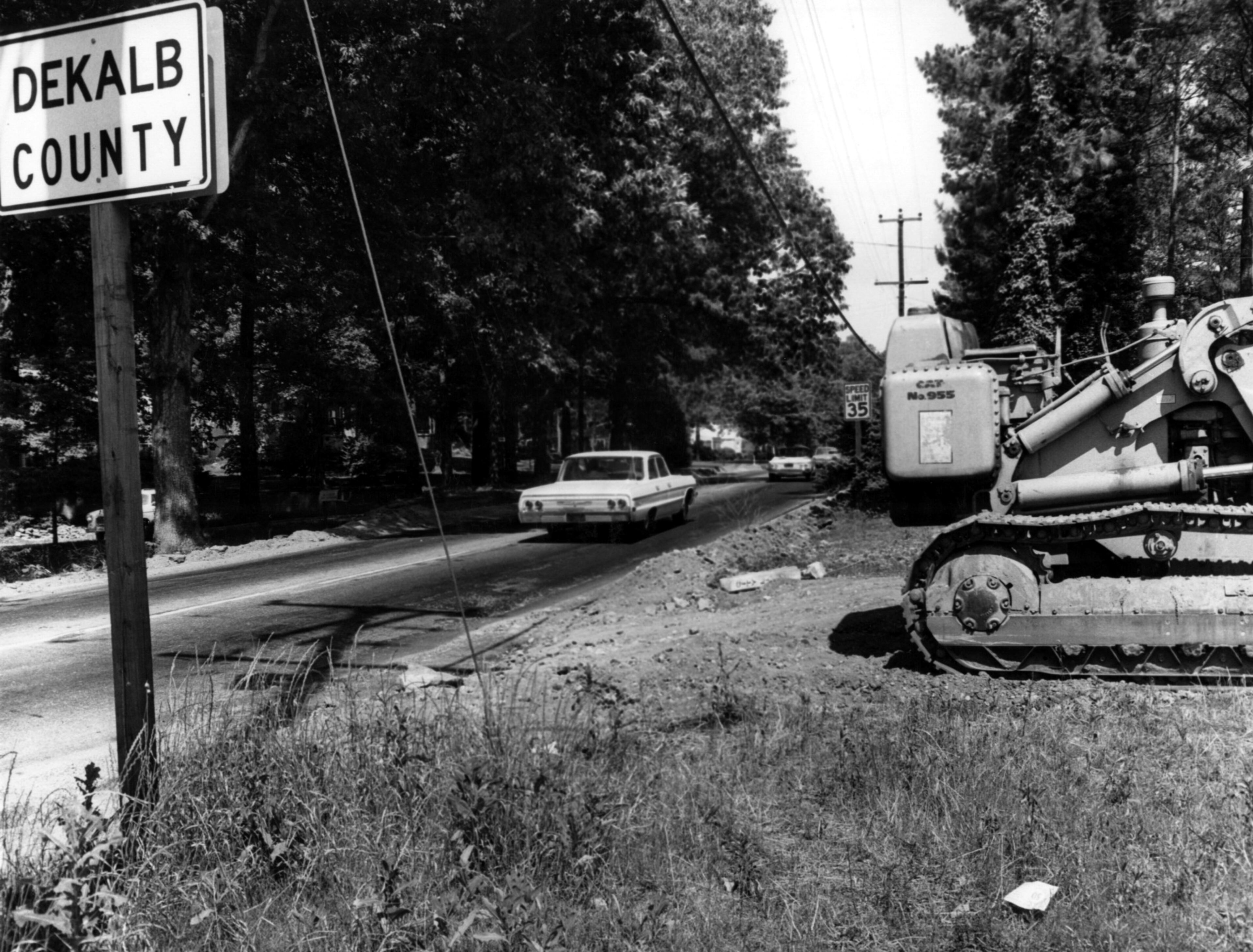 LaVista Road, just off of Cheshire Bridge Road, in 1964. The original caption reads: "LaVista Road, one of the main roads in DeKalb County, is currently undergoing widening and resurfacing. The work on LaVista runs from Cheshire Bridge Road to Lawrenceville Highway. (Charles Pugh/AJC staff)