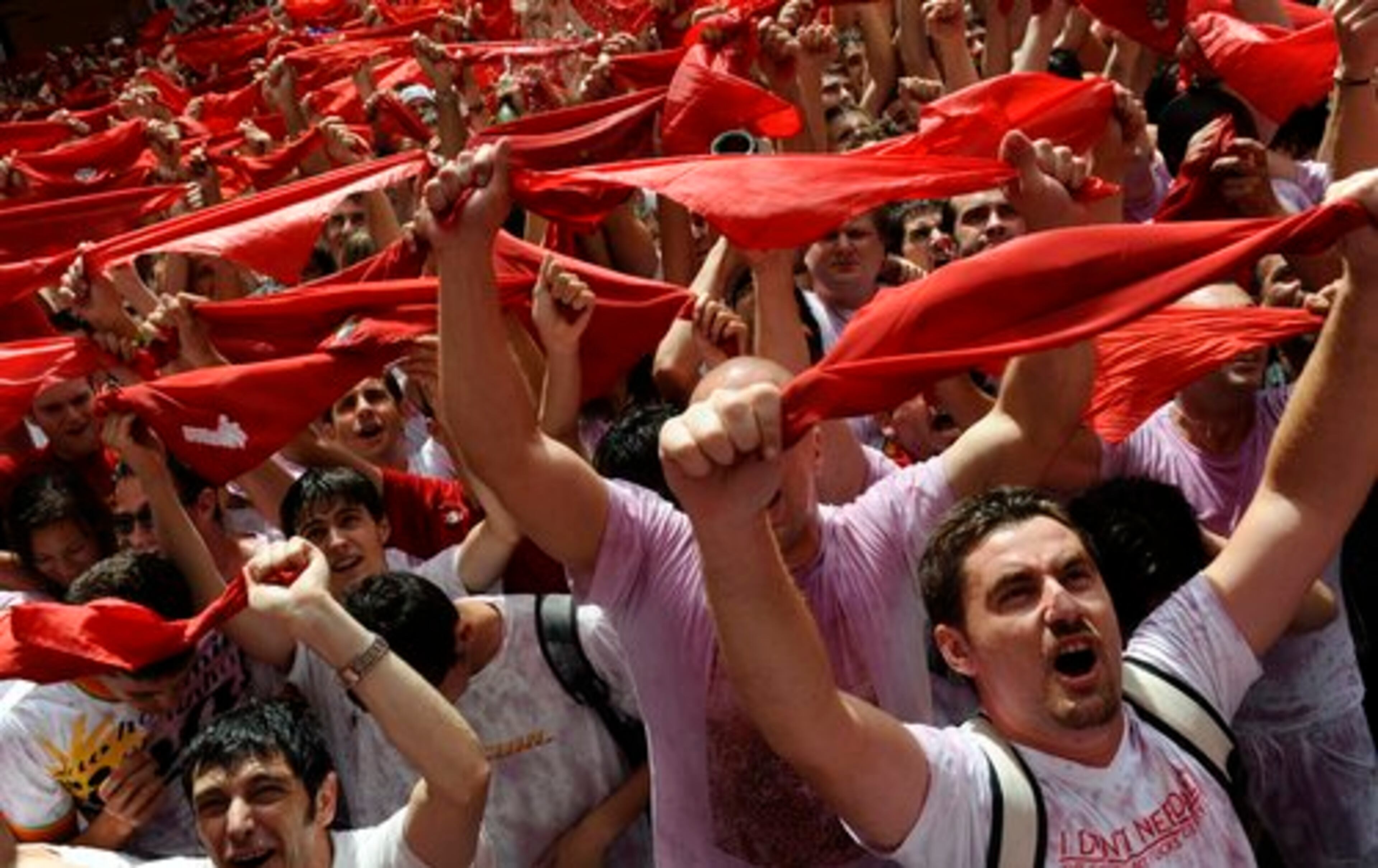 People came from all over the world to test their bravery and enjoy nonstop street parties. Spanish Television said about 2,000 people took part in the first of eight runs at the famed San Fermin festival, made famous by Ernest Hemingway's novel "The Sun Also Rises." Above, revelers with traditional red neck ties.