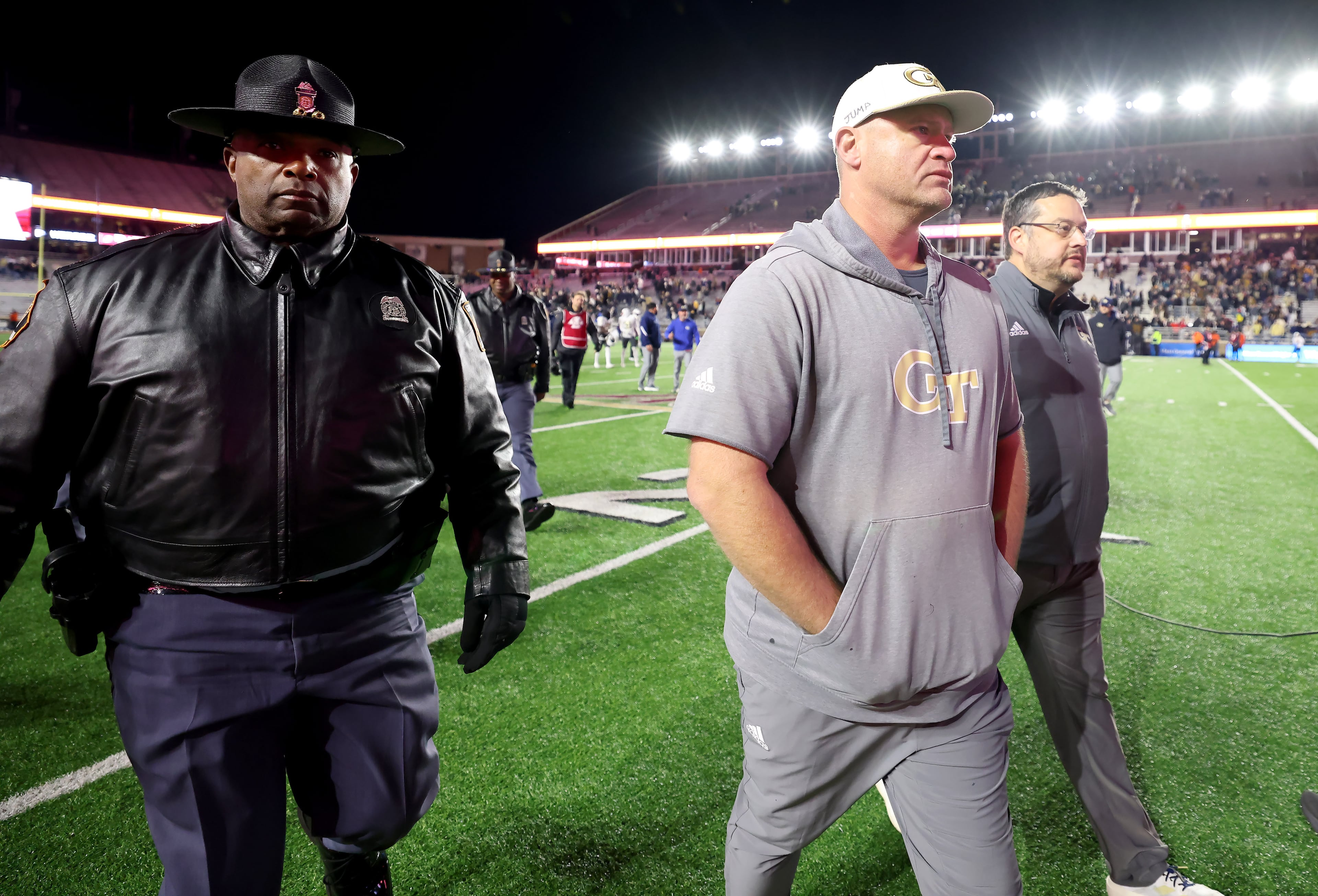 Georgia Tech head coach Brent Key, front right, walks off the field after his team defeated Boston College in an NCAA college football game Saturday, Nov. 15, 2025, in Boston. (AP Photo/Mark Stockwell)