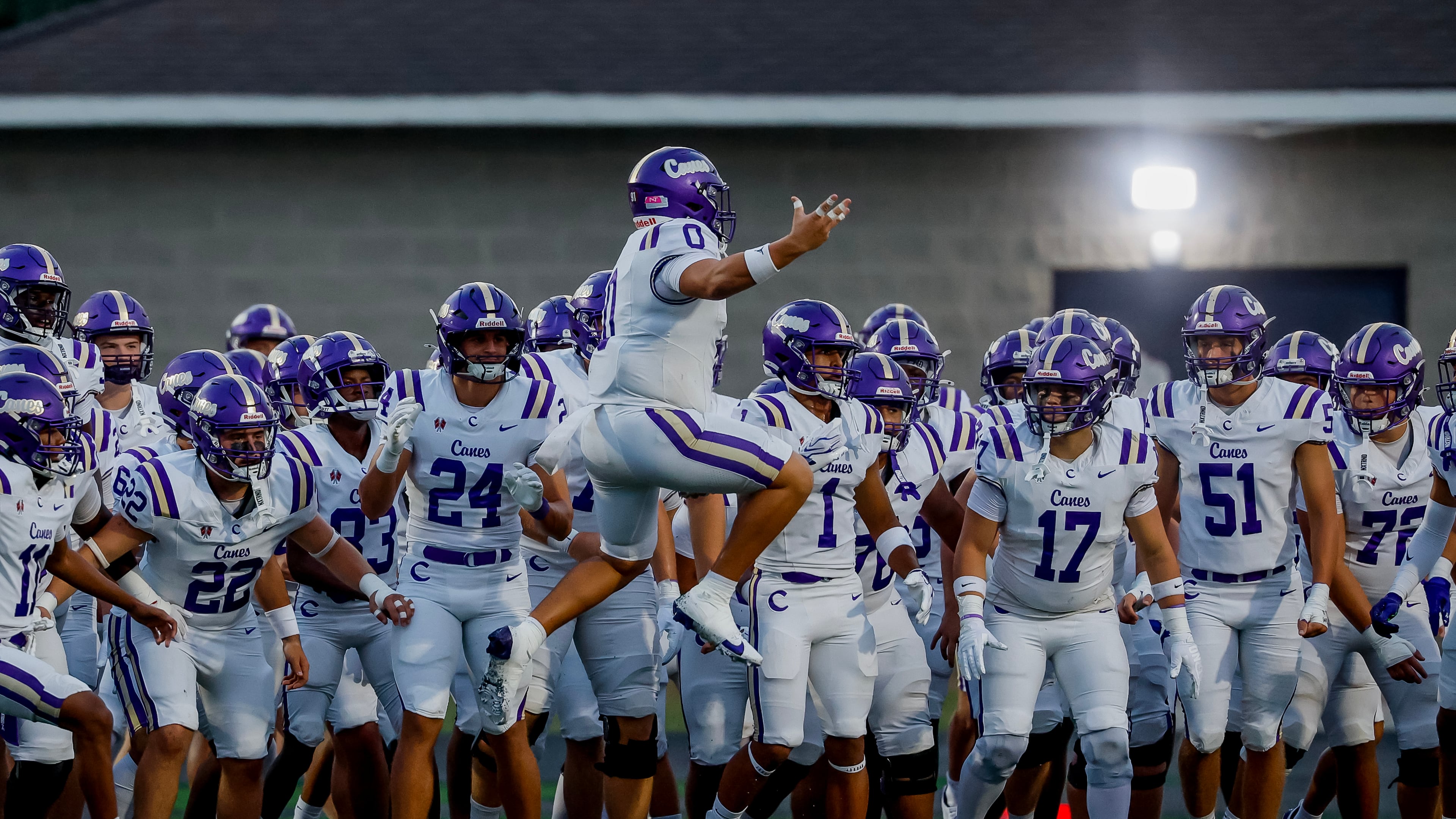 Cartersville defensive lineman Grayson Villar leads his teammates onto the field before their game against Hiram on Friday, Aug. 21, 2026. (Erik S. Lesser for the AJC)