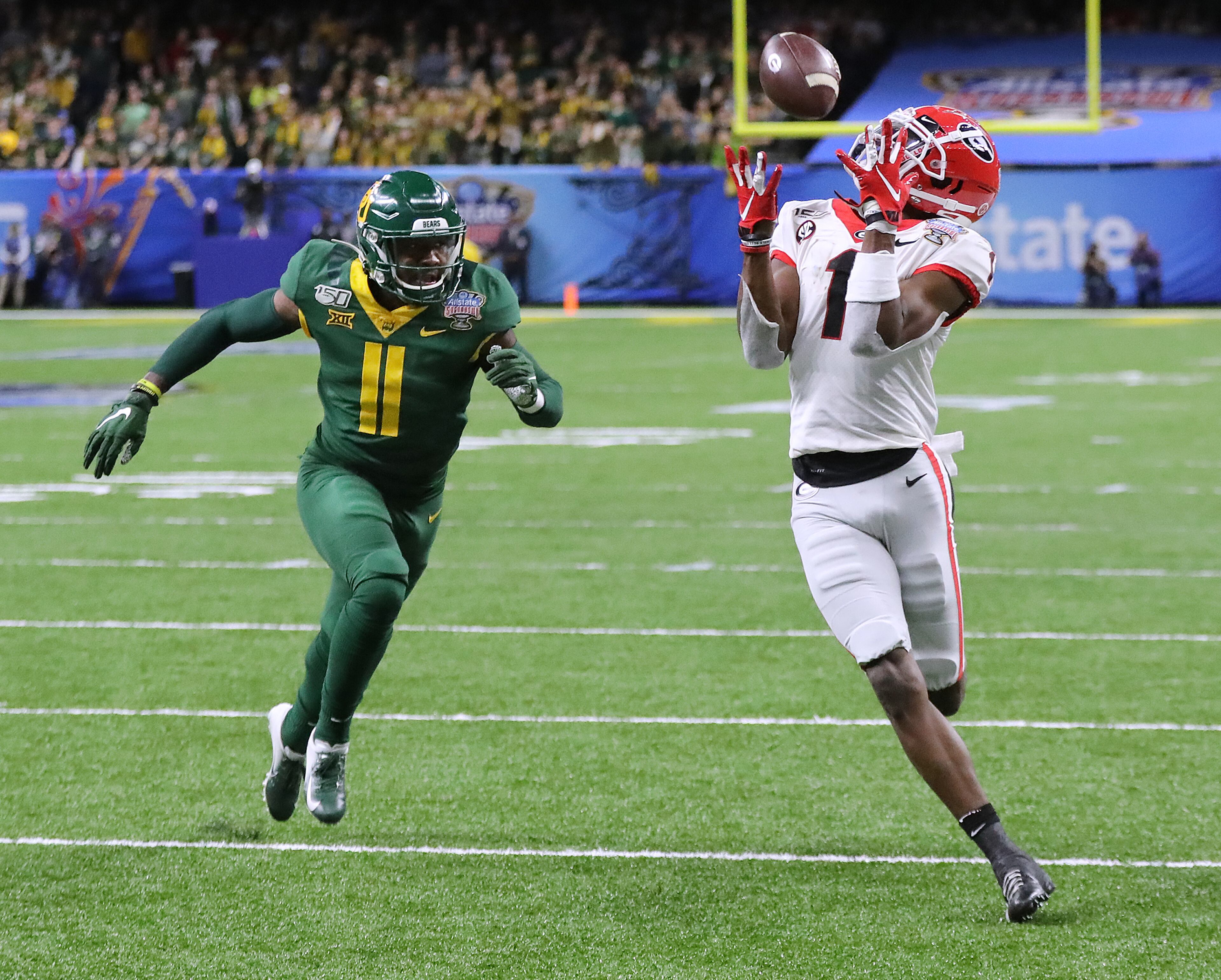 Georgia wide receiver George Pickens catches a touchdown pass past Baylor cornerback Jameson Houston for a 10-0 lead during the second quarter in the Sugar Bowl NCAA college football game at the Superdome on Wednesday, January 1, 2020, in New Orleans. Curtis Compton ccompton@ajc.com